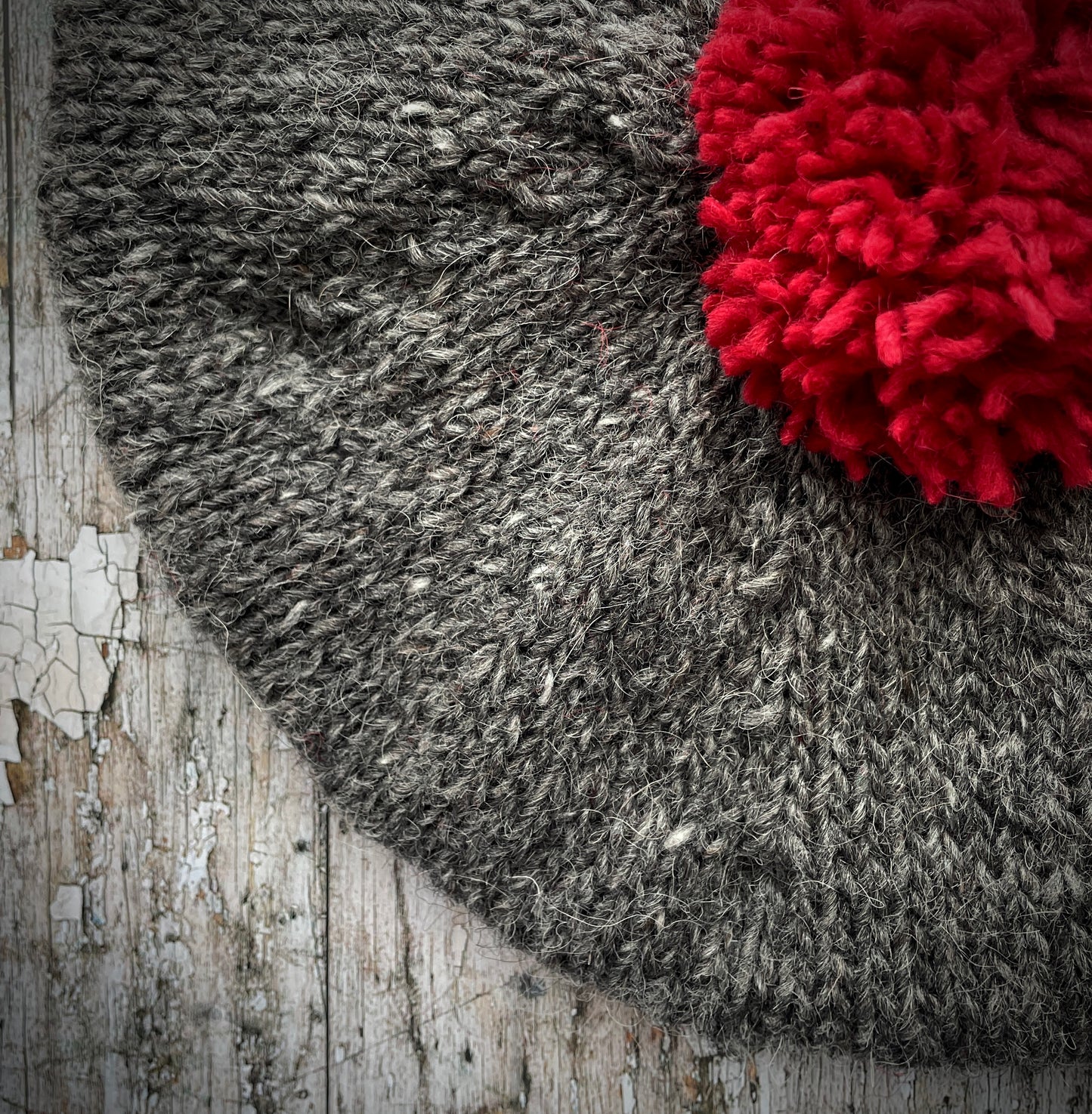Hand Knitted Wool Beret Grey Heather + Red
Beautifully hand knitted beret in Icelandic Lettlopi pure wool, perfect for keeping your head warm on cold days. Knitted in a lovely grey heather colour with a red pom and red ribbed band that gives the hat a snug fit.
SIZE: adult.
CARE: hand wash or machine wash on wool cycle at 30 degrees, dry flat, do not tumble dry.