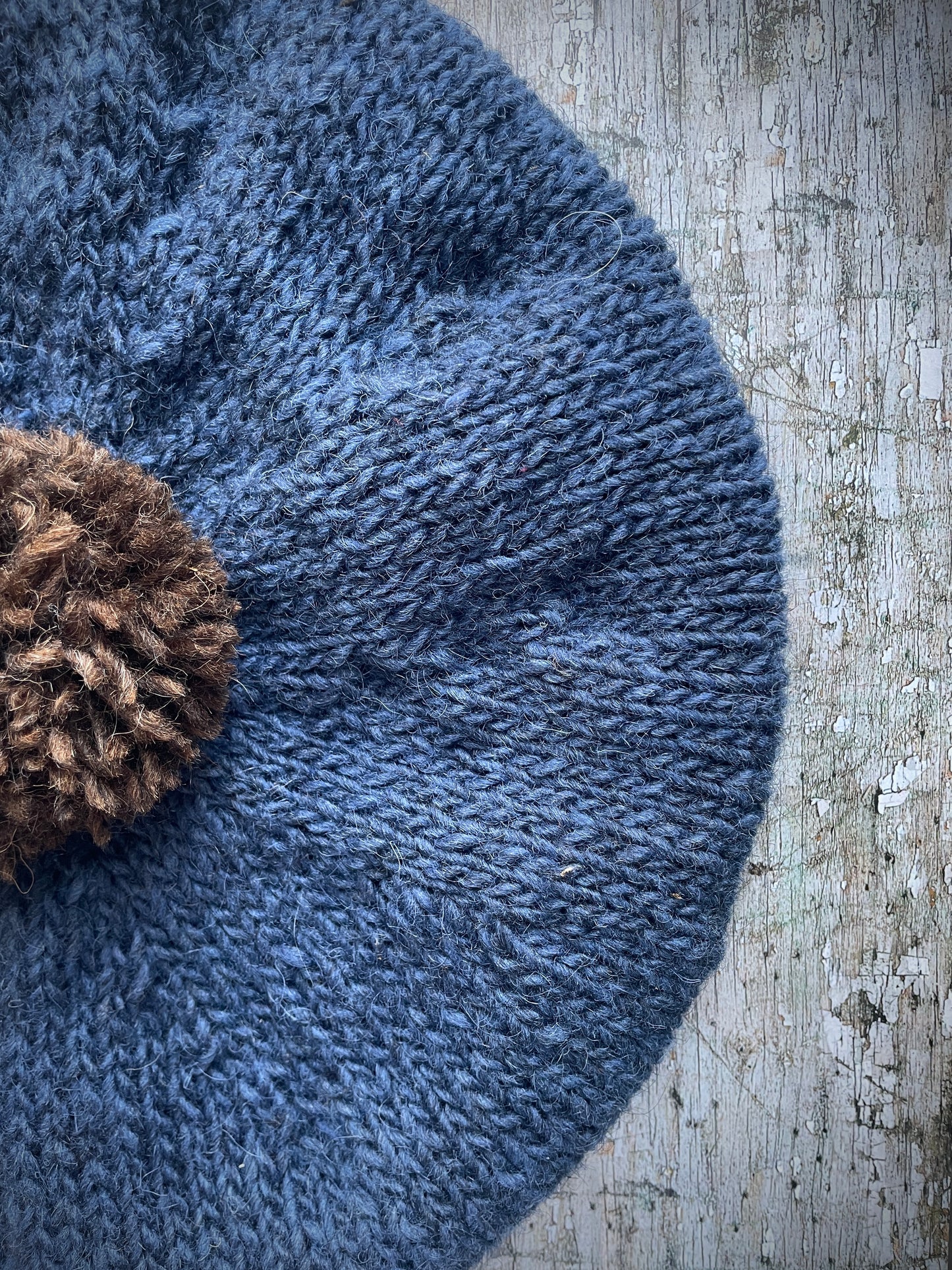 Hand Knitted Wool Beret Denim Blue + Dark Chocolate
Beautifully hand knitted beret in Icelandic Lettlopi pure wool, perfect for keeping your head warm on cold days. Knitted in a lovely denim blue colour with a dark chocolate brown pom and denim blue ribbed band that gives the hat a snug fit.
SIZE: adult.
CARE: hand wash or machine wash on wool cycle at 30 degrees, dry flat, do not tumble dry.