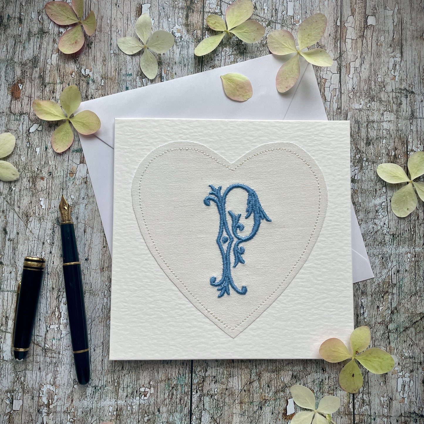 Embroidered Initial Card Blue P
Beautifully made one of a kind romantic card suitable for any occasion, or just to frame. The initial P has been embroidered with blue colour thread onto a piece of heart shaped vintage linen, then sewn onto a good quality acid free white 225 gsm hammered card, the inside left blank for your own special message. It comes with a simple white envelope in a cello bag.
Size: 6" x 6" / 15cm x 15cm