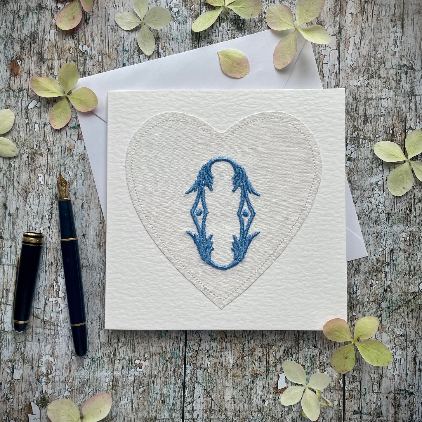 Embroidered Initial Card Blue O
Beautifully made one of a kind romantic card suitable for any occasion, or just to frame. The initial O has been embroidered with blue colour thread onto a piece of heart shaped vintage linen, then sewn onto a good quality acid free white 225 gsm hammered card, the inside left blank for your own special message. It comes with a simple white envelope in a cello bag.
Size: 6" x 6" / 15cm x 15cm