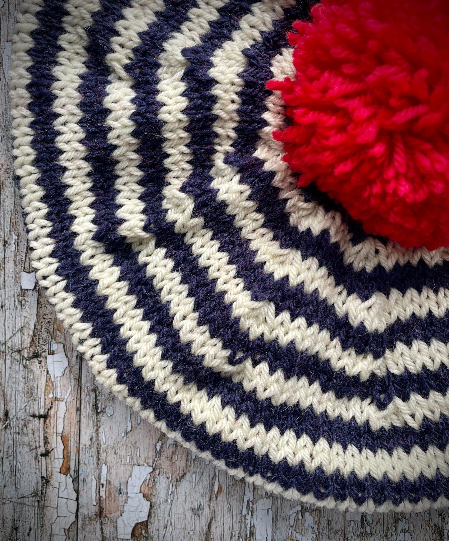 Children's Breton Stripe Beret 2 - 3 Years
This nautical style beret, has been beautifully hand knitted with Rowan pure new wool in navy blue and cream stripes. It has a big red pom and a navy blue ribbed band that gives the hat a snug fit. Perfect for keeping little heads warm on cold days and would look stunning on boys or girls.
SIZE: child 2 - 3 years, Diameter: 27cm / 10+1/2"