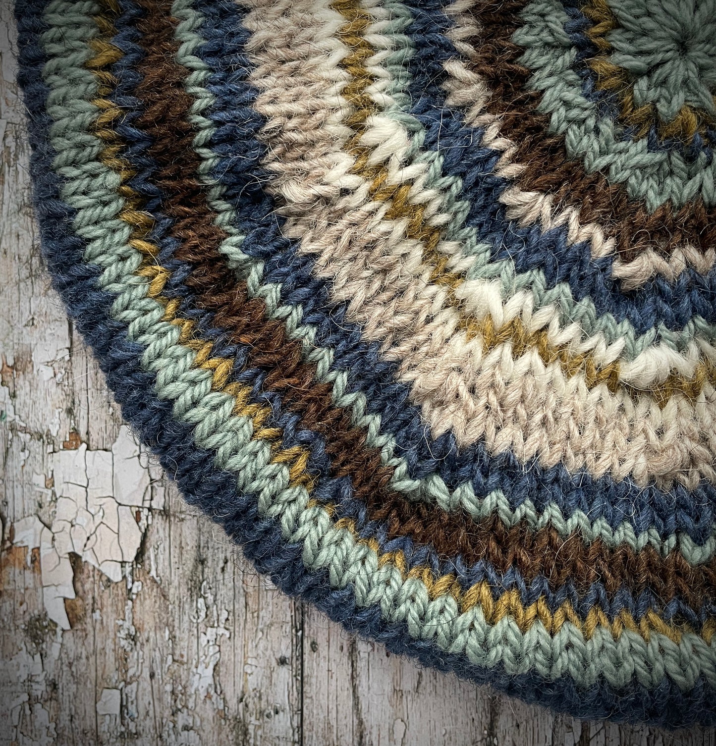 Classic 40's Style Beret no.44
Beautifully hand knitted beret in Icelandic Lettlopi wool, perfect for keeping your head warm on cold days and adding a touch of 40's style to any outfit. Knitted in oat, dark chocolate brown, denim blue, white, kelp, and sage stripes, with an oat ribbed band that gives the hat a snug fit.
SIZE: adult.
CARE: hand wash or machine wash on wool cycle at 30 degrees, dry flat, do not tumble dry.