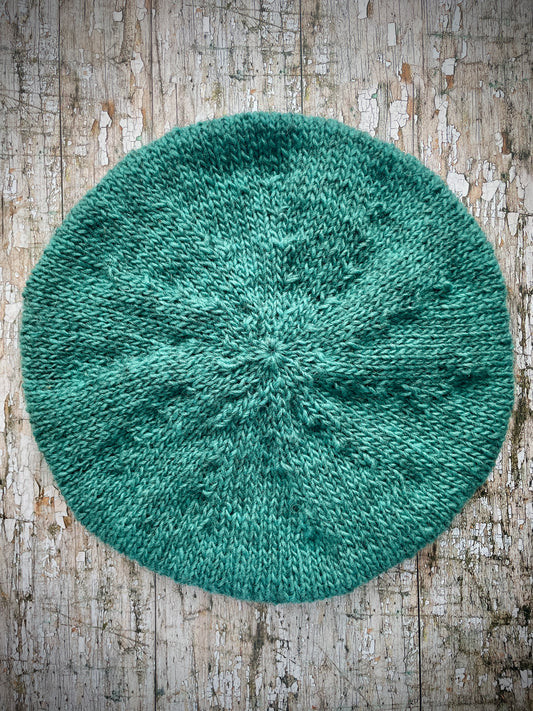 Hand Knitted Wool Beret Viridian
Beautifully hand knitted beret in Icelandic Lettlopi pure wool, perfect for keeping your head warm on cold days and knitted in a lovely viridian colour, with a ribbed band that gives the hat a snug fit.
SIZE: adult.
DIAMETER: 11+3/4" / 29.5cm.
CARE: hand wash or machine wash on wool cycle at 30 degrees, dry flat, do not tumble dry.