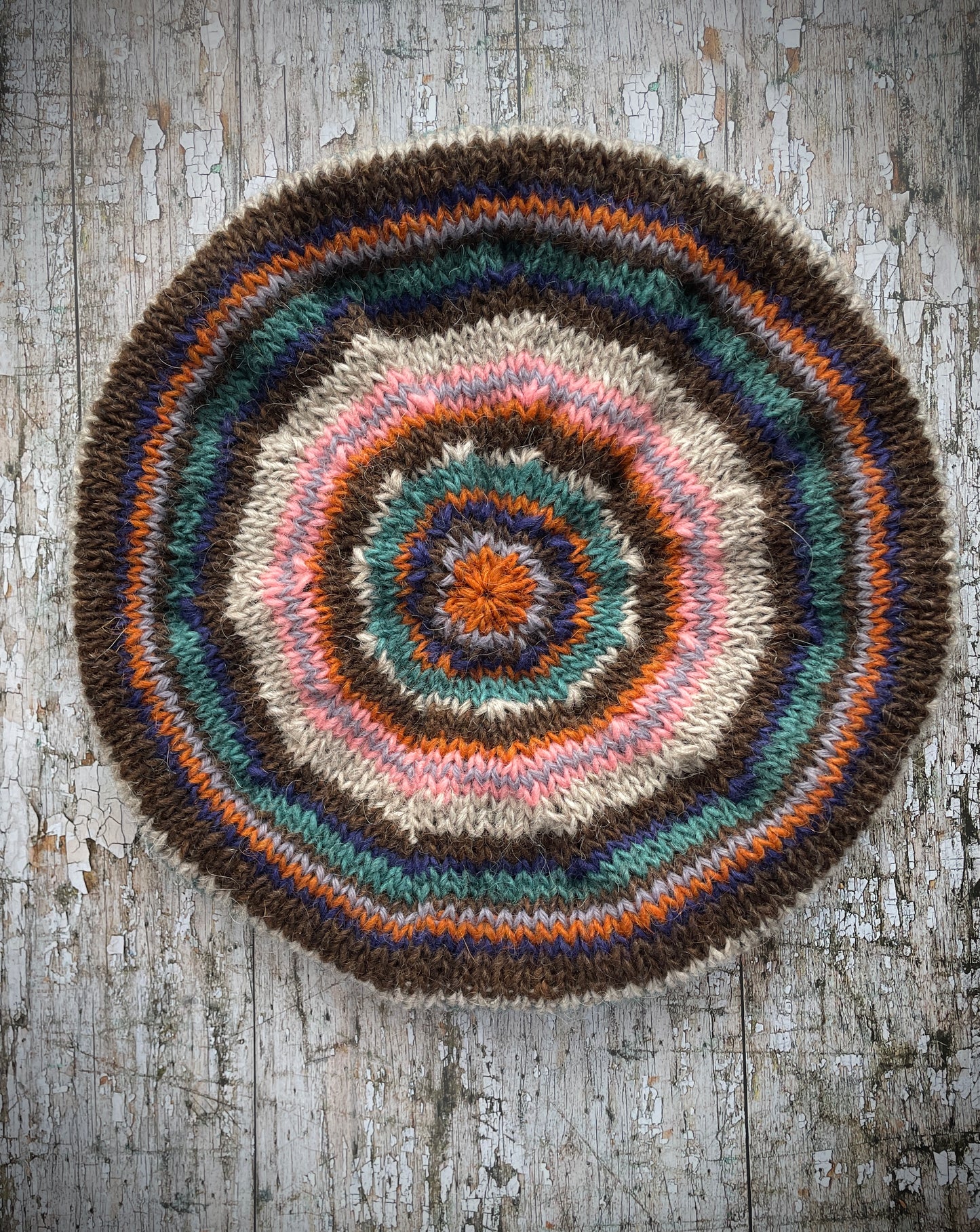 Classic 40's Style Beret no.28
Beautifully hand knitted beret in Icelandic Lettlopi wool, perfect for keeping your head warm on cold days and adding a touch of 40's style to any outfit. Knitted in oat, viridian, dark chocolate brown, pink, lavender, purple and orange stripes, with an oat ribbed band that gives the hat a snug fit.
SIZE: adult.
CARE: hand wash or machine wash on wool cycle at 30 degrees, dry flat, do not tumble dry.