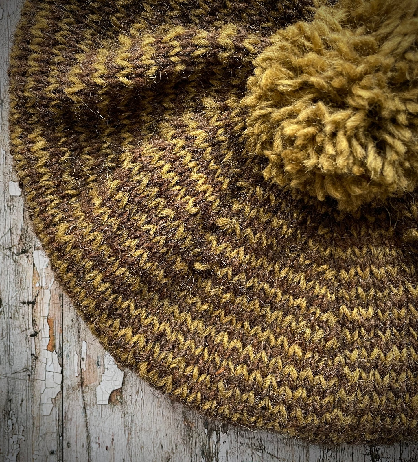 Dark Chocolate + Kelp Striped Wool Beret
Beautifully hand knitted with Lettlopi pure new wool, in half plain dark chocolate brown and half kelp stripes, with a big chocolate brown pom and a ribbed band that gives the hat a snug fit. Perfect for keeping your head warm on cold days.
SIZE: adult.
CARE: hand wash or machine wash on wool cycle at 30 degrees, dry flat, do not tumble dry.