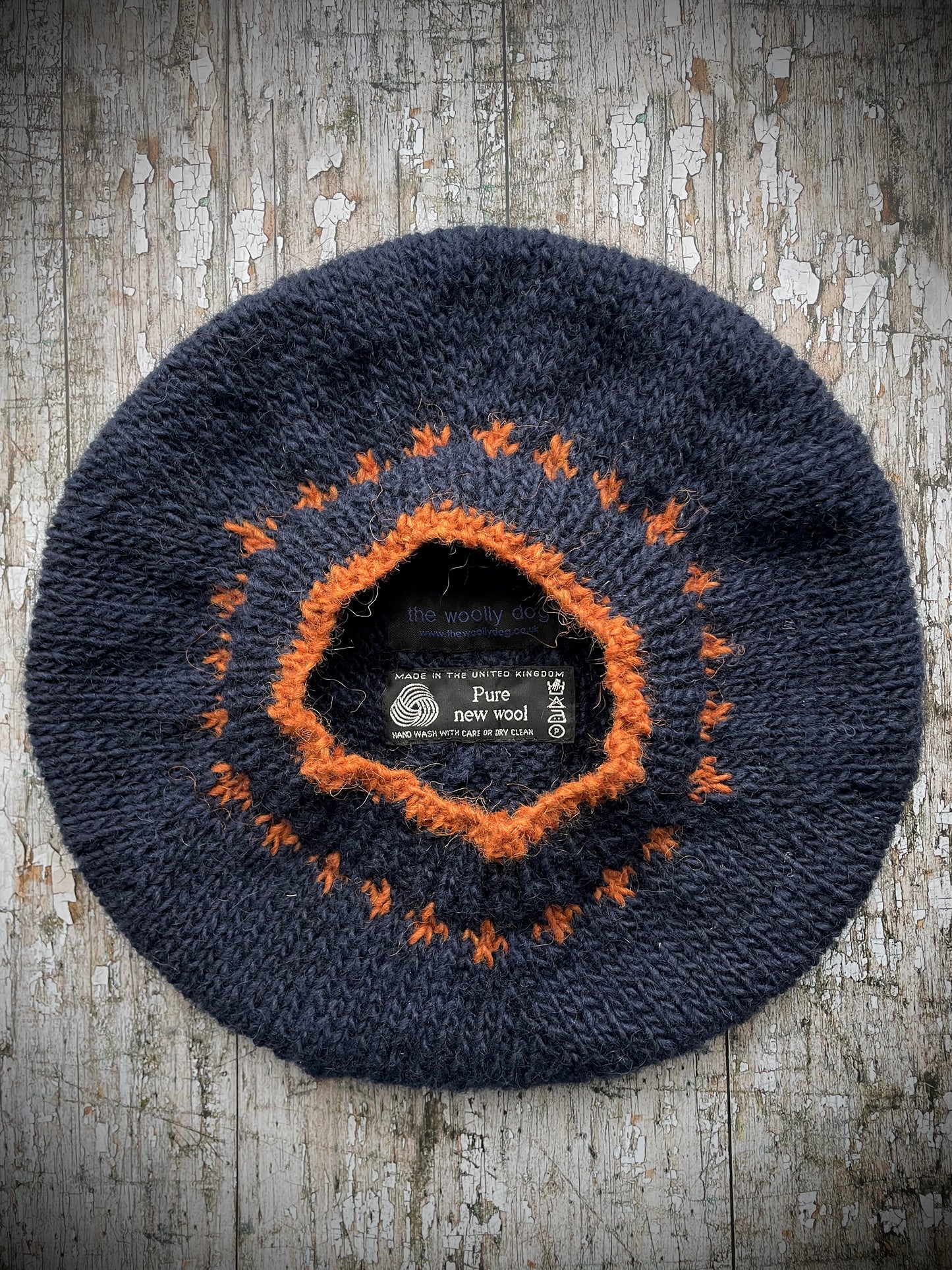 Hand Knitted Beret In Navy Blue + Burnt Orange Wool.
Beautifully hand knitted beret in Icelandic Lettlopi pure wool, perfect for keeping your head warm on cold days. Knitted in navy blue with a burnt orange pattern and a ribbed band that gives the hat a snug fit.
SIZE: adult.
CARE: hand wash or machine wash on wool cycle at 30 degrees, dry flat, do not tumble dry.