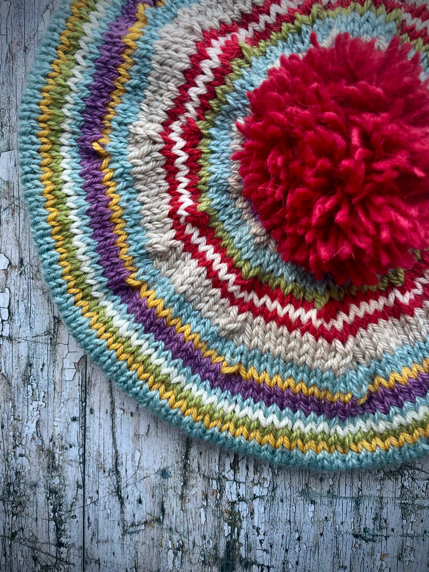 Children's 40's Style Beret 6 - 18 months
Beautifully hand knitted beret in Rowan and Yarn Stories pure wool, perfect for keeping little heads warm on cold days. Knitted in faun, mauve, pale blue, red, white and yellow stripes with a big red pom and a faun ribbed band that gives the hat a snug fit, it would look stunning on boys or girls.
SIZE: child 6 - 24 months Diameter 26cm / 10".
CARE: hand wash or machine wash on wool cycle at 30 degrees, dry flat, do not tumble dry.