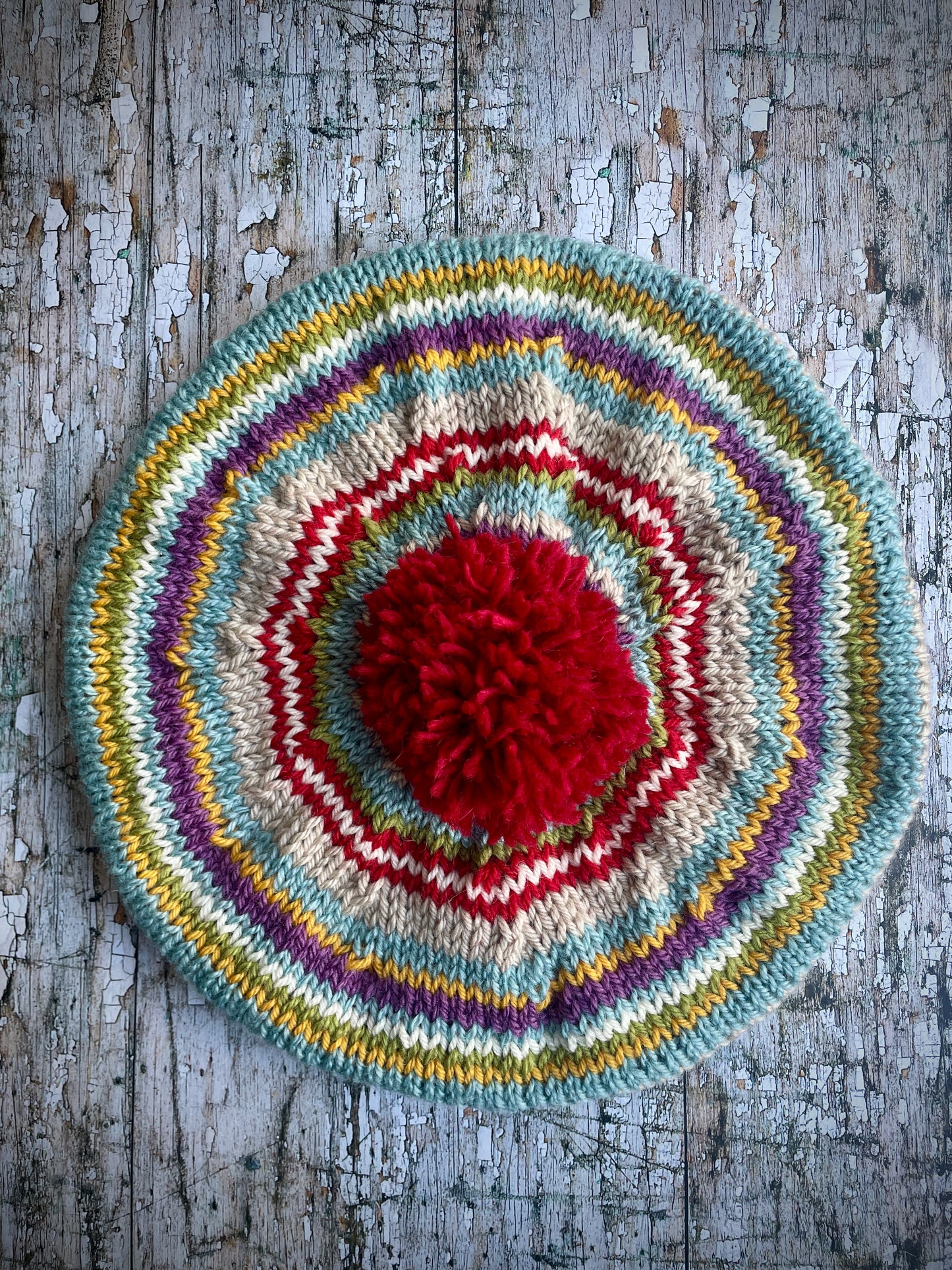 Children's 40's Style Beret 6 - 18 mths
Beautifully hand knitted beret in Rowan and Yarn Stories pure wool, perfect for keeping little heads warm on cold days. Knitted in faun, mauve, pale blue, red, white and yellow stripes with a big red pom and a faun ribbed band that gives the hat a snug fit, it would look stunning on boys or girls.
SIZE: child 6 - 24 months Diameter 26cm / 10".
CARE: hand wash or machine wash on wool cycle at 30 degrees, dry flat, do not tumble dry.