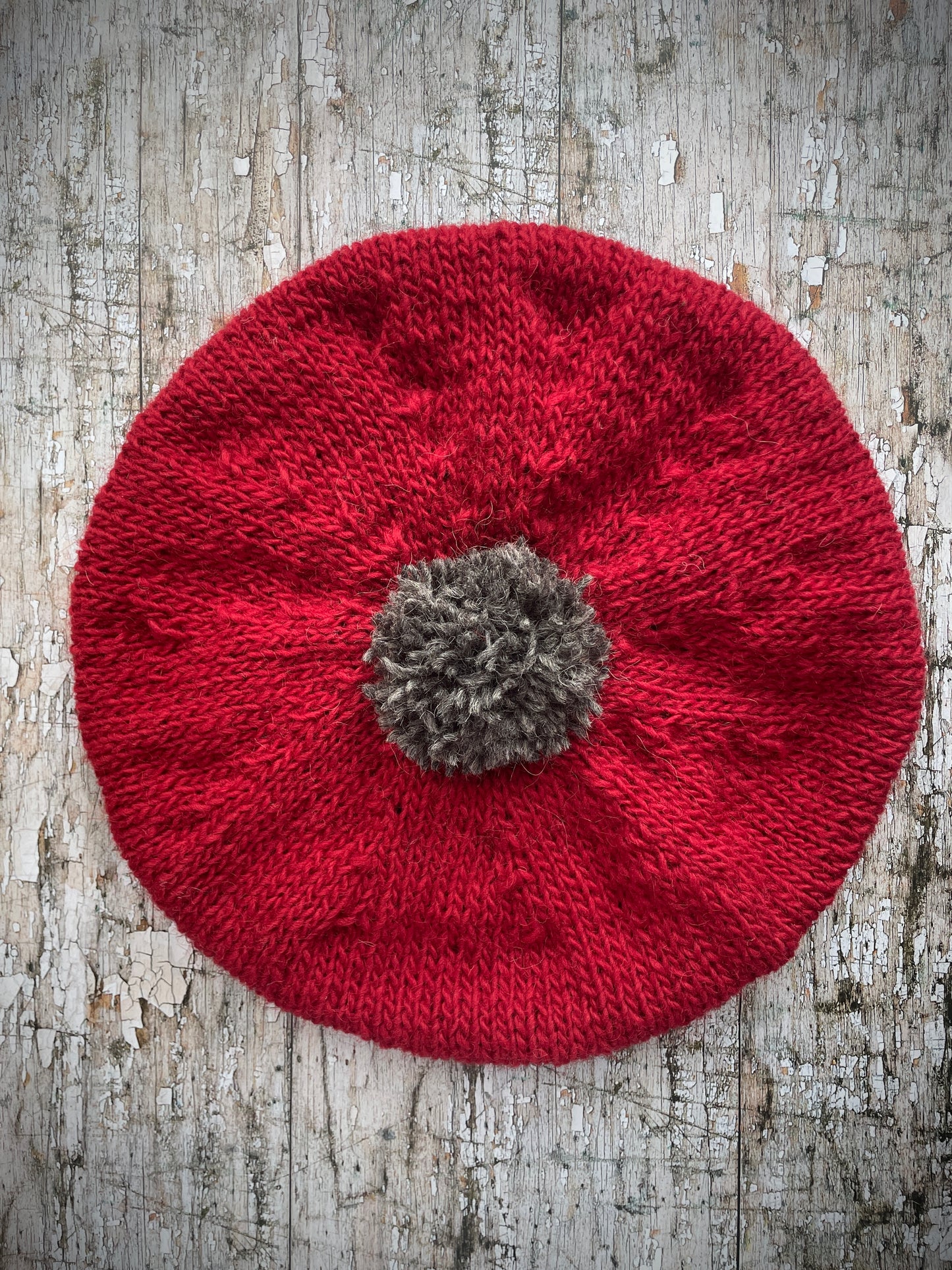 Hand Knitted Wool Beret Red + Grey Tweed
Beautifully hand knitted beret in Icelandic pure wool, perfect for keeping your head warm on cold days. Knitted in red with a grey pom and grey ribbed band that gives the hat a snug fit.
SIZE: adult.
CARE: hand wash or machine wash on wool cycle at 30 degrees, dry flat, do not tumble dry.