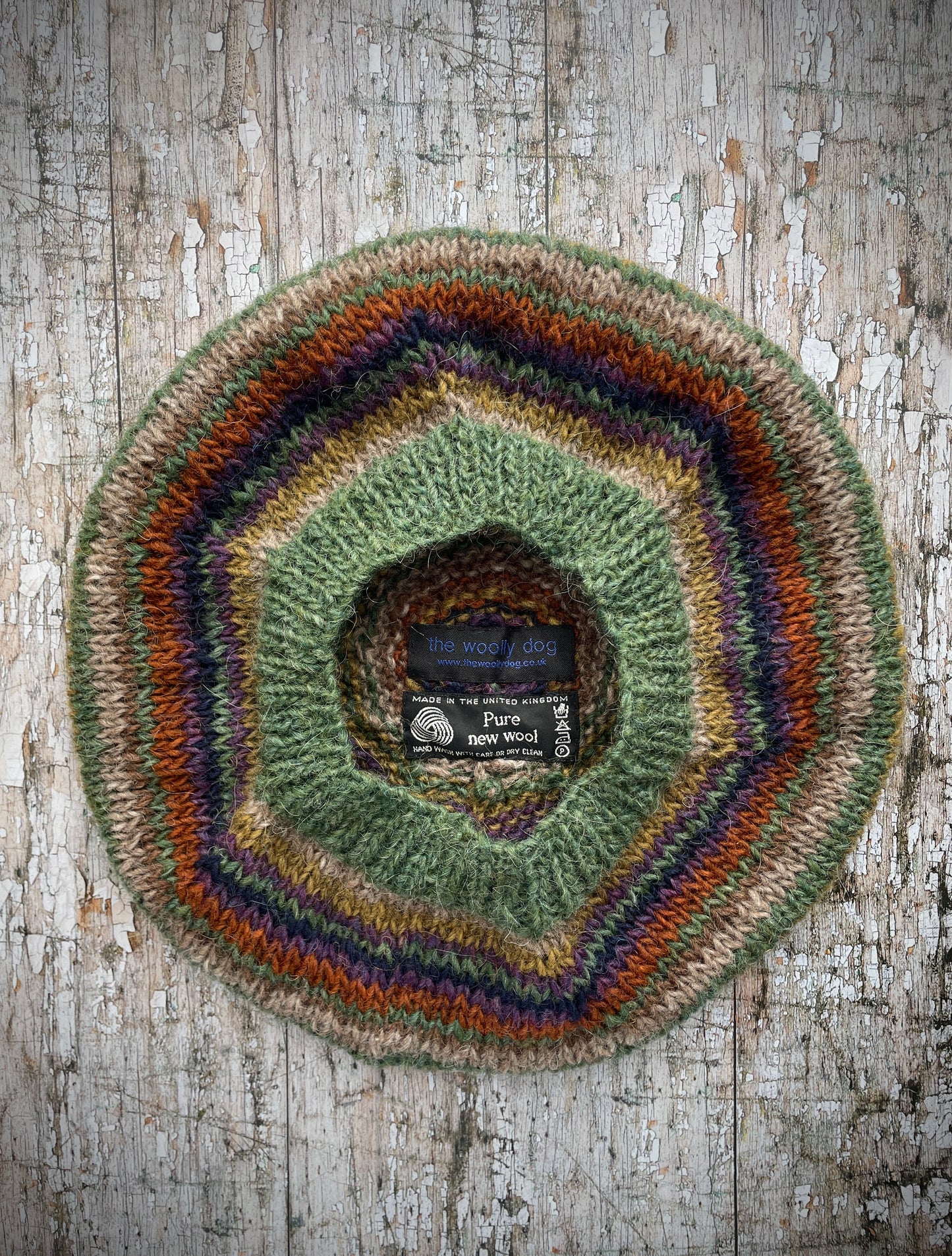 Classic 40's Style Beret no.18
Beautifully hand knitted beret in Icelandic wool, perfect for keeping your head warm on cold days and adding a touch of 40's style to any outfit. Knitted green heather, dark oat, kelp, violet heather, navy, burnt orange and milk chocolate stripes, with a green heather ribbed band that gives the hat a snug fit.
SIZE: adult.
CARE: hand wash or machine wash on wool cycle at 30 degrees, dry flat, do not tumble dry.