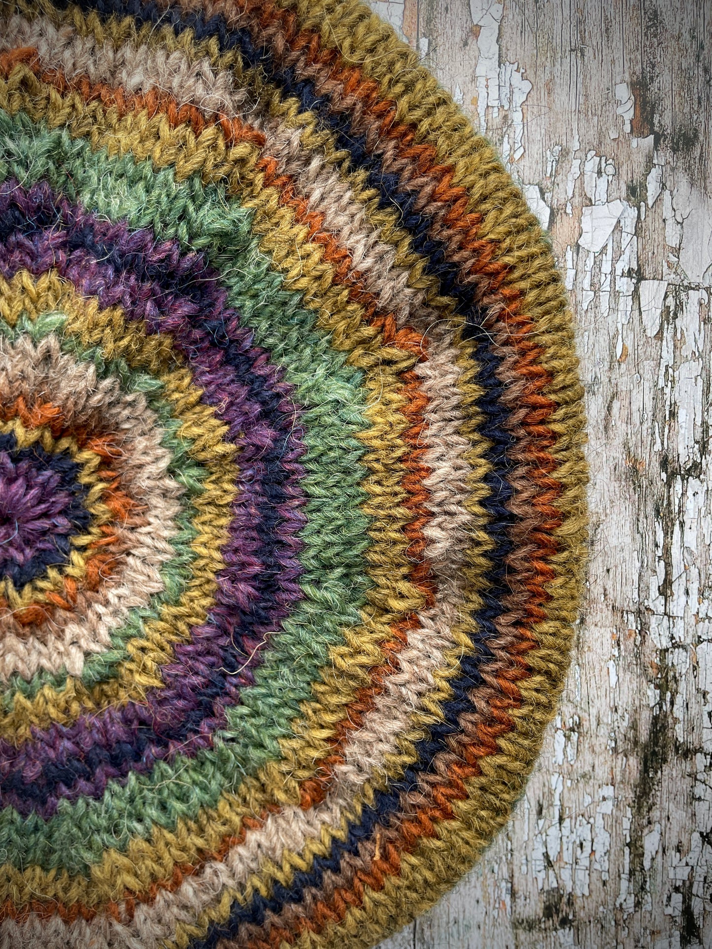 Classic 40's Style Beret no.18
Beautifully hand knitted beret in Icelandic wool, perfect for keeping your head warm on cold days and adding a touch of 40's style to any outfit. Knitted green heather, dark oat, kelp, violet heather, navy, burnt orange and milk chocolate stripes, with a green heather ribbed band that gives the hat a snug fit.
SIZE: adult.
CARE: hand wash or machine wash on wool cycle at 30 degrees, dry flat, do not tumble dry.
