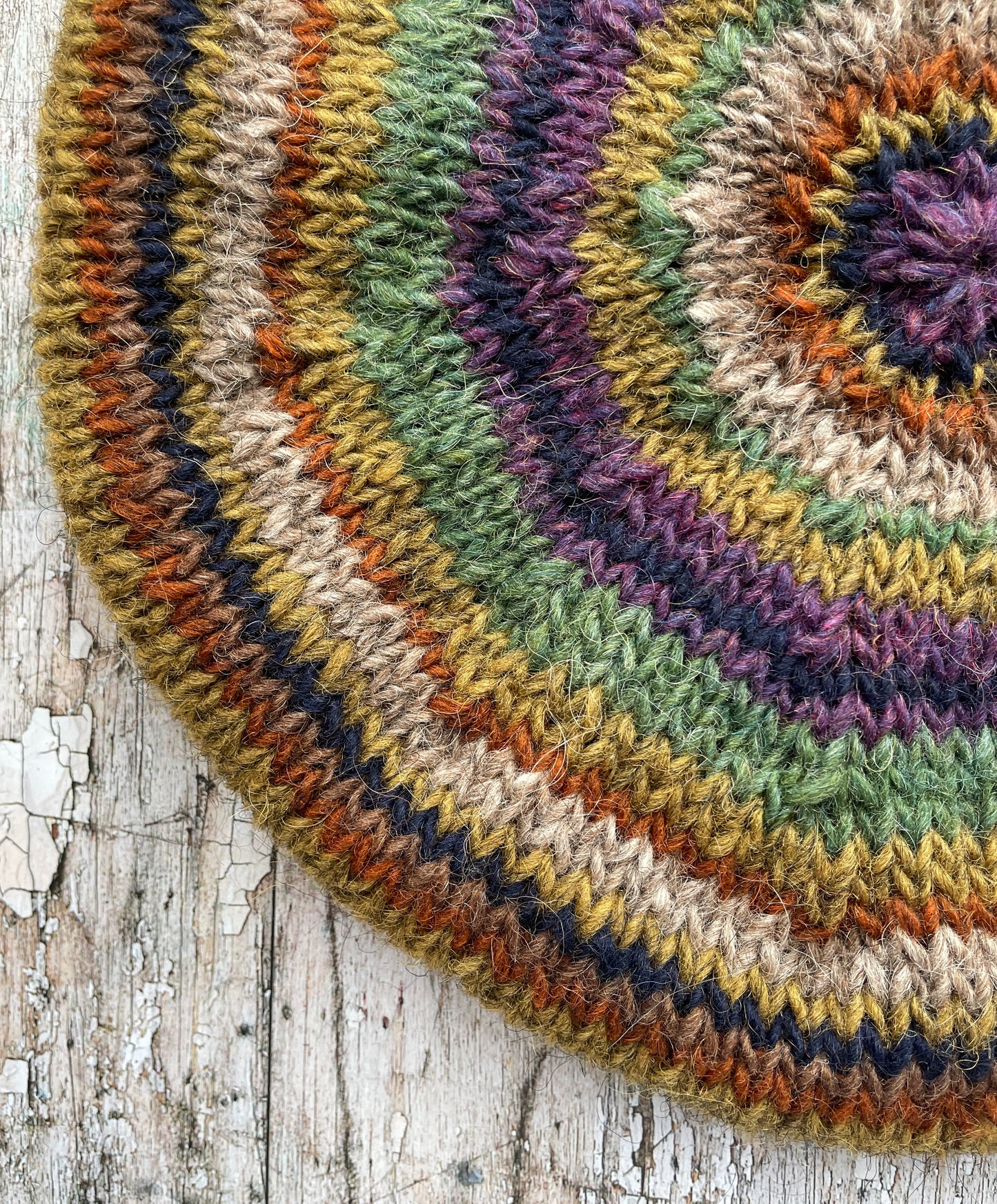 Classic 40's Style Beret no.18
Beautifully hand knitted beret in Icelandic wool, perfect for keeping your head warm on cold days and adding a touch of 40's style to any outfit. Knitted green heather, dark oat, kelp, violet heather, navy, burnt orange and milk chocolate stripes, with a green heather ribbed band that gives the hat a snug fit.
SIZE: adult.
CARE: hand wash or machine wash on wool cycle at 30 degrees, dry flat, do not tumble dry.