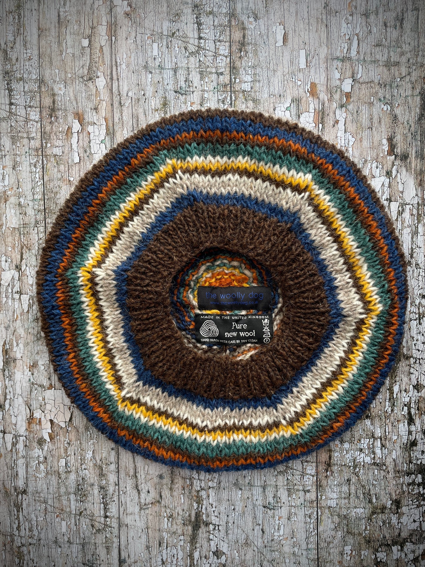 CLASSIC 40's STYLE ADULT'S BERET style 1
Beautifully hand knitted beret in Icelandic pure wool, perfect for keeping your head warm on cold days and adding a touch of 40's style to any outfit. Knitted in dark chocolate brown, bright blue, oat, white, yellow, viridian and orange stripes, with a brown band that gives the hat a snug fit.
ONE SIZE: adult.
CARE: hand wash or machine wash on wool cycle at 30 degrees, dry flat, do not tumble dry.