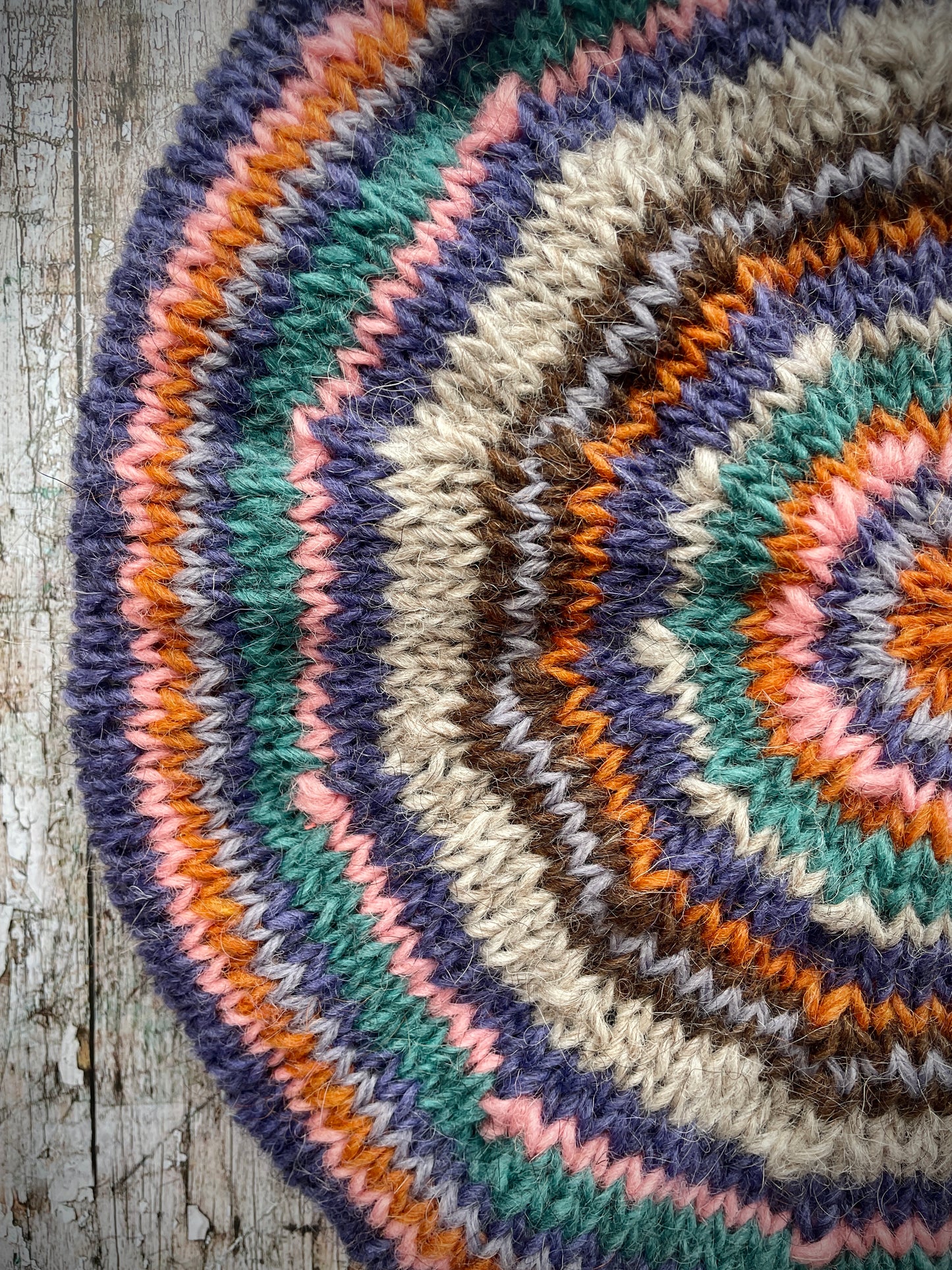 Beautifully hand knitted beret in Icelandic wool, perfect for keeping your head warm on cold days and adding a touch of 40's style to any outfit. Knitted in oat, viridian, violet, dark chocolate, mauve, pink and orange stripes, with an oat ribbed band that gives the hat a snug fit.
SIZE: adult.
CARE: hand wash or machine wash on wool cycle at 30 degrees, dry flat, do not tumble dry.