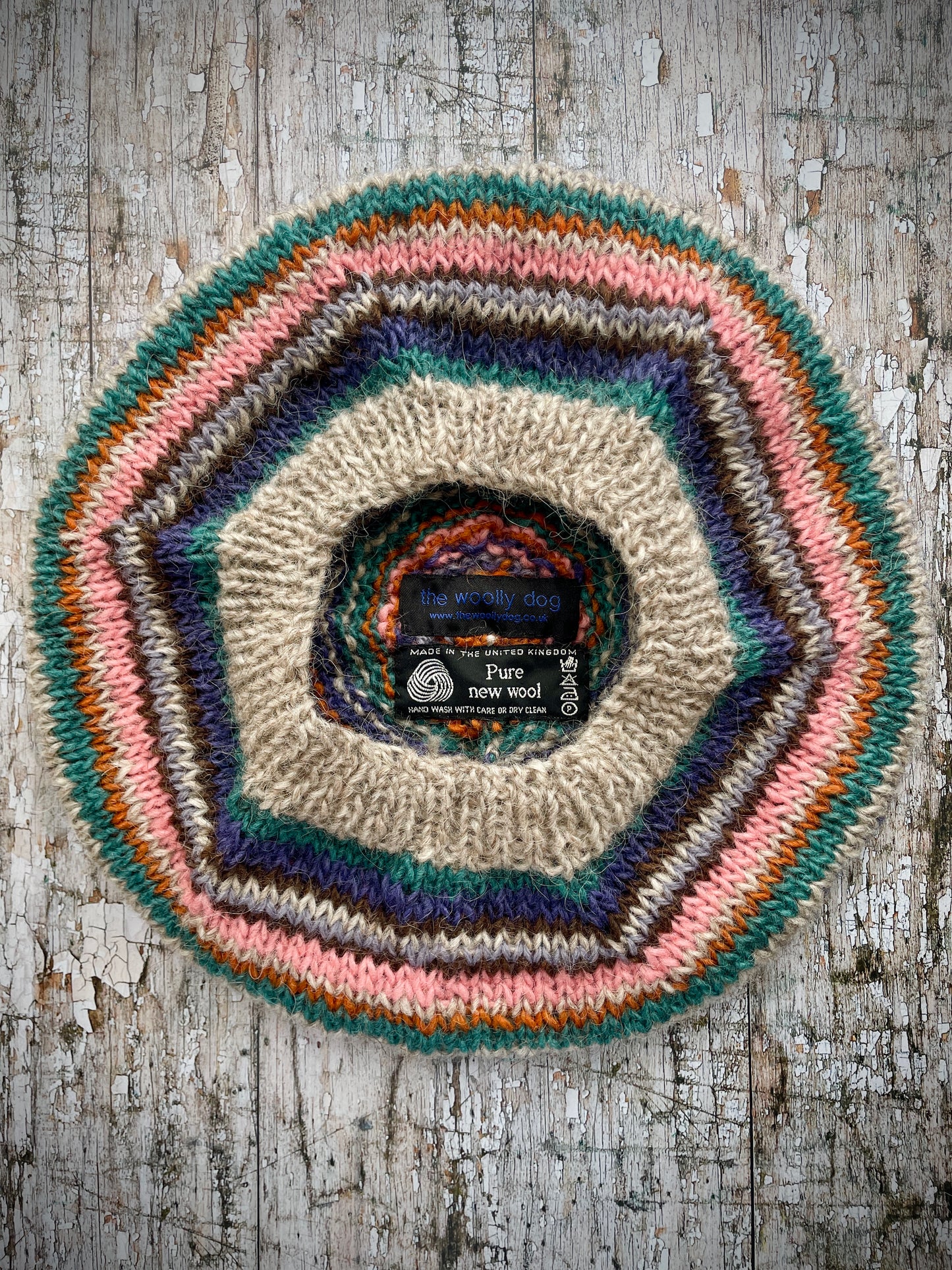 Beautifully hand knitted beret in Icelandic wool, perfect for keeping your head warm on cold days and adding a touch of 40's style to any outfit. Knitted in oat, viridian, violet, dark chocolate, mauve, pink and orange stripes, with an oat ribbed band that gives the hat a snug fit.
SIZE: adult.
CARE: hand wash or machine wash on wool cycle at 30 degrees, dry flat, do not tumble dry.