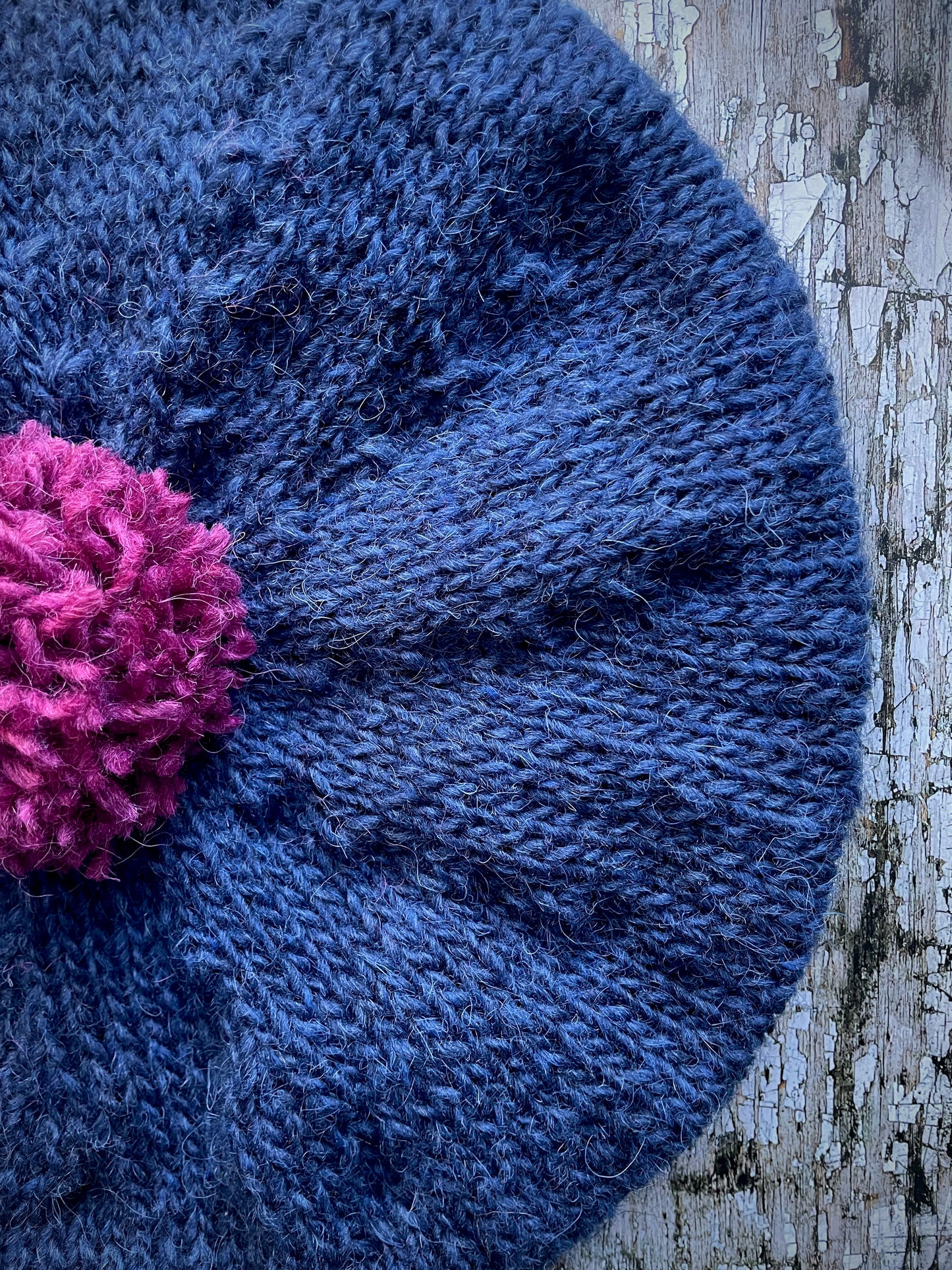 Hand Knitted Wool Indigo + Fuchsia Beret
Beautifully hand knitted beret in Icelandic pure wool, perfect for keeping your head warm on cold days. Knitted in a beautiful indigo blue, with a big fuchsia pom and indigo ribbed band that gives the hat a snug fit.
SIZE: adult.
CARE: hand wash or machine wash on wool cycle at 30 degrees, dry flat, do not tumble dry.