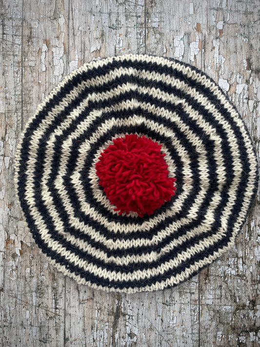 Navy Blue + White + Red Breton Stripes Wool Beret
Nautical style beret, beautifully hand knitted with Icelandic pure new wool, in Breton stripes of navy blue and white, with a big red pom and a navy blue ribbed band that gives the hat a snug fit. Perfect for keeping your head warm on cold days.
SIZE: adult.
DIAMETER: 11+1/2" / 29 cm.
CARE: hand wash or machine wash on wool cycle at 30 degrees, dry flat, do not tumble dry.