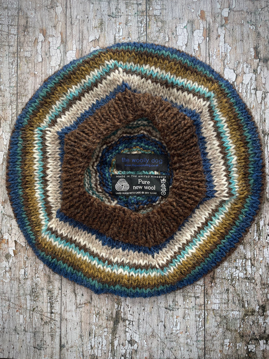 Classic 40's Style Beret no.14
Beautifully hand knitted beret in Icelandic wool, perfect for keeping your head warm on cold days and adding a touch of 40's style to any outfit. Knitted in dark chocolate brown, indigo blue, oat, white, aqua heather, dark kelp and viridian stripes, with a dark chocolate brown ribbed band that gives the hat a snug fit.
SIZE: adult.
DIAMETER: 11+1/4" / 28.5cm.
CARE: hand wash or machine wash on wool cycle at 30 degrees, dry flat, do not tumble dry.
