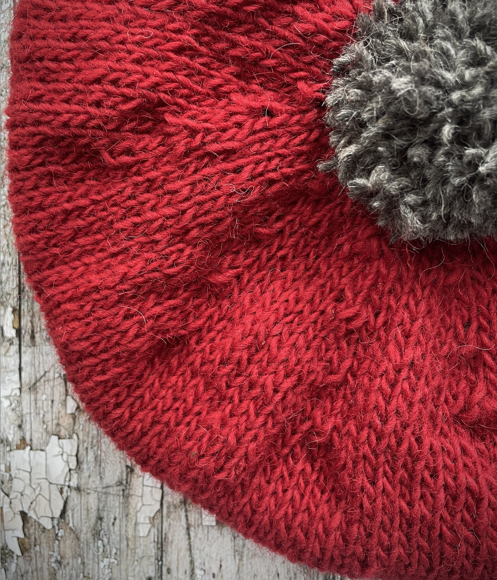 Hand Knitted Wool Beret Red + Grey Tweed
Beautifully hand knitted beret in Icelandic pure wool, perfect for keeping your head warm on cold days. Knitted in red with a grey pom and grey ribbed band that gives the hat a snug fit.
SIZE: adult.
CARE: hand wash or machine wash on wool cycle at 30 degrees, dry flat, do not tumble dry.