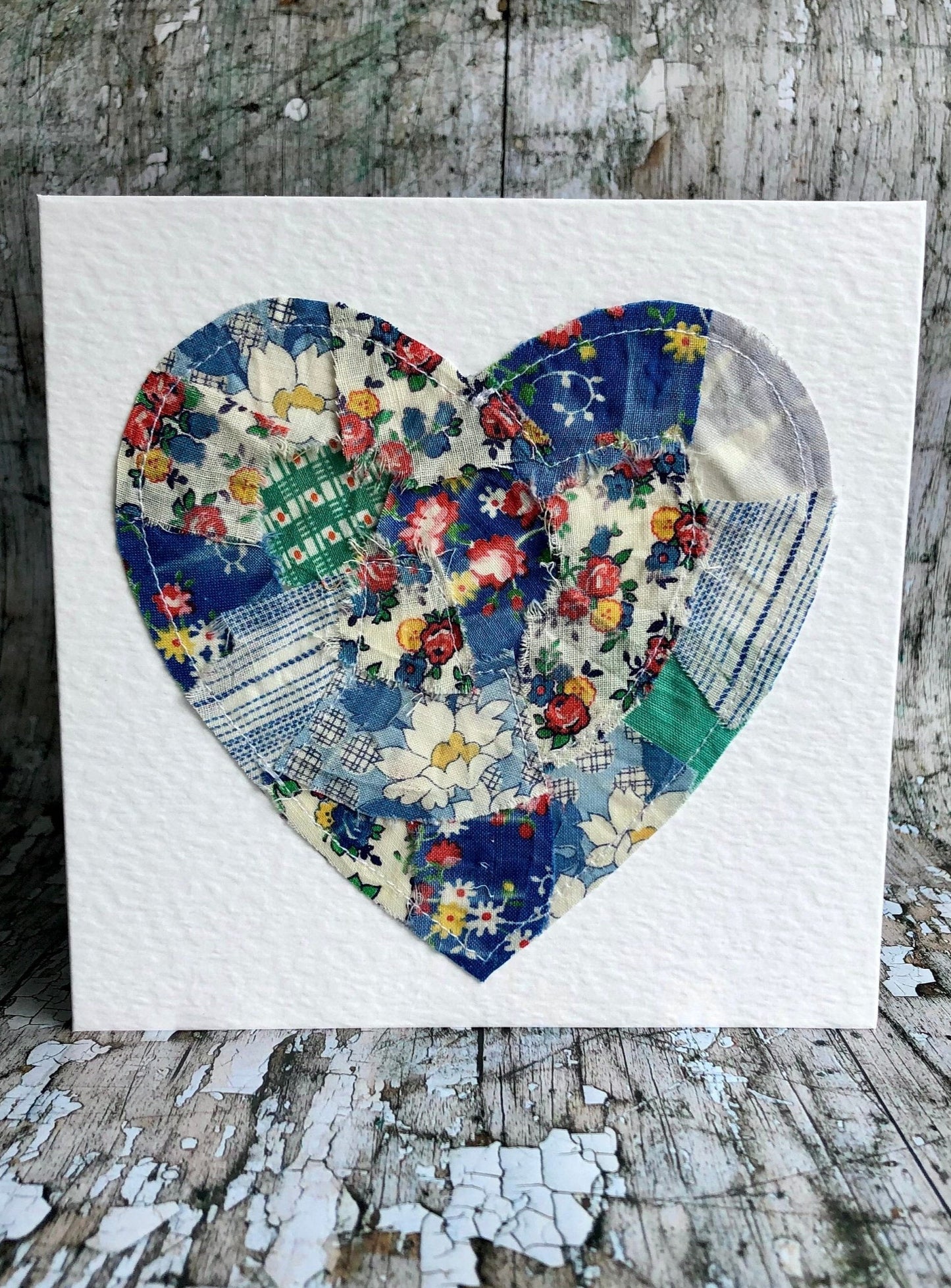 Vintage Feed Sack Card no.9
A beautifully made one of a kind greeting card suitable for any occasion, or just to frame. The heart has been made by carefully patching together sections of genuine vintage feed sack fabrics from the 30's - 50's, on good quality white 225 gsm hammered card, with a simple white envelope in a cello bag. The back of the card is printed with the history of American feed sack fabrics, and the inside left blank for your own special message.
Size: 6" x 6" / 15cm x 15cm