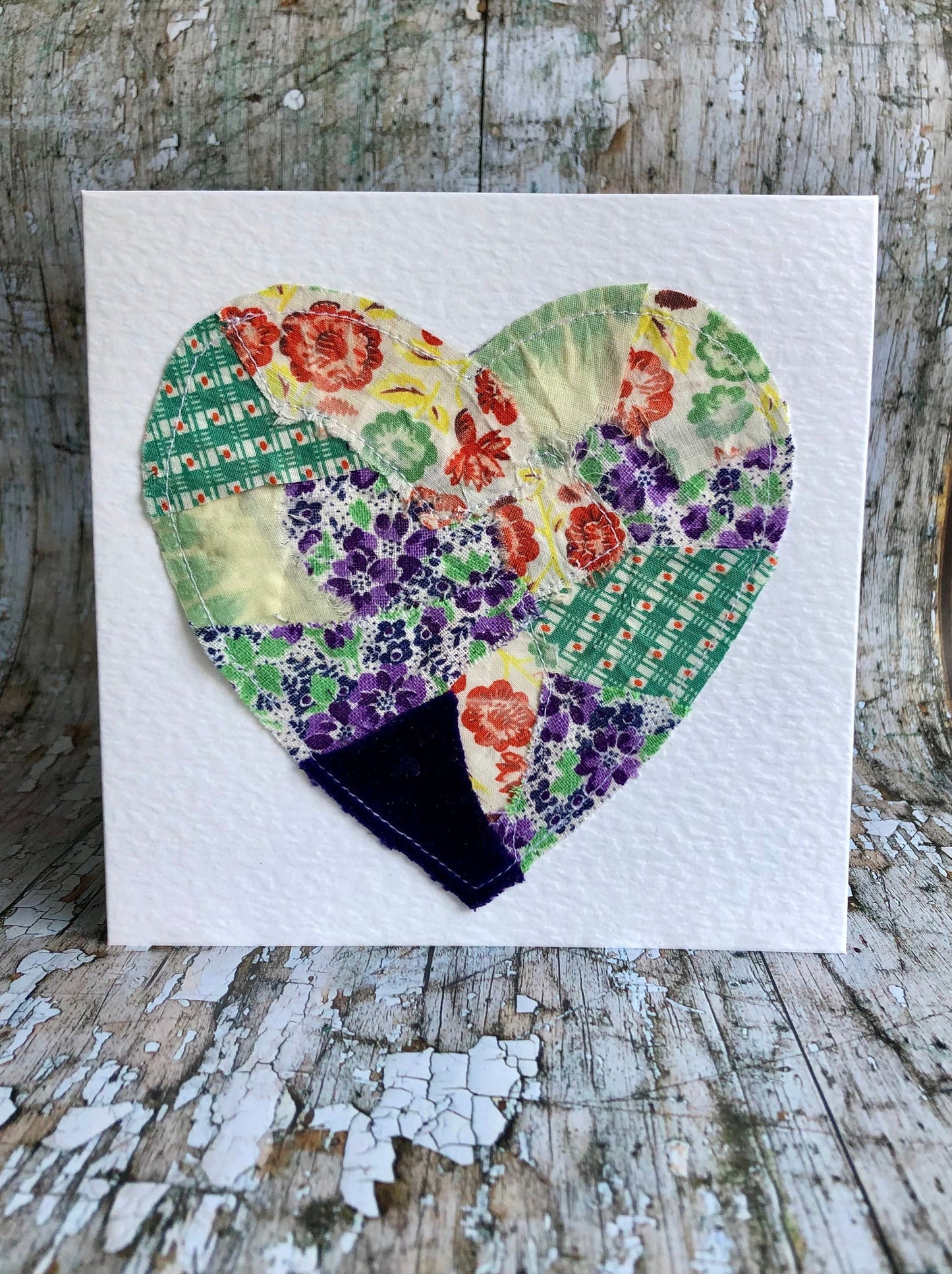 Vintage Feed Sack Card no.11
A beautifully made one of a kind greeting card suitable for any occasion, or just to frame. The heart has been made by carefully patching together sections of genuine vintage feed sack fabrics from the 30's - 50's, on good quality white 225 gsm hammered card, with a simple white envelope in a cello bag. The back of the card is printed with the history of American feed sack fabrics, and the inside left blank for your own special message.
Size: 6" x 6" / 15cm x 15cm