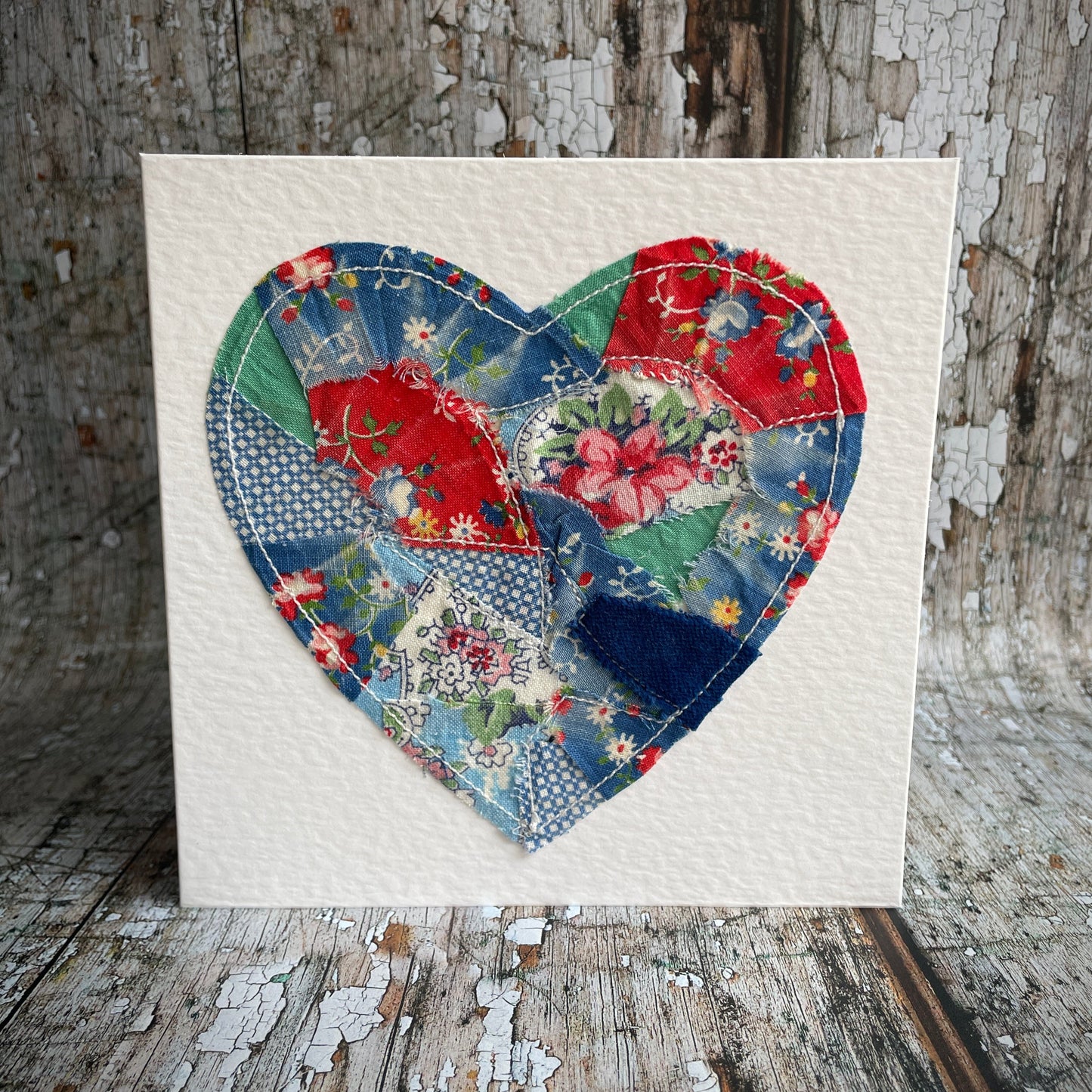 Vintage Feed Sack Card no.17

A beautifully made one of a kind greeting card suitable for any occasion, or just to frame. The heart has been made by carefully patching together sections of genuine vintage feed sack fabrics from the 30's - 50's, on good quality white 225 gsm hammered card, with a simple white envelope in a cello bag. The back of the card is printed with the history of American feed sack fabrics, and the inside left blank for your own special message.

Size: 6" x 6" / 15cm x 15cm