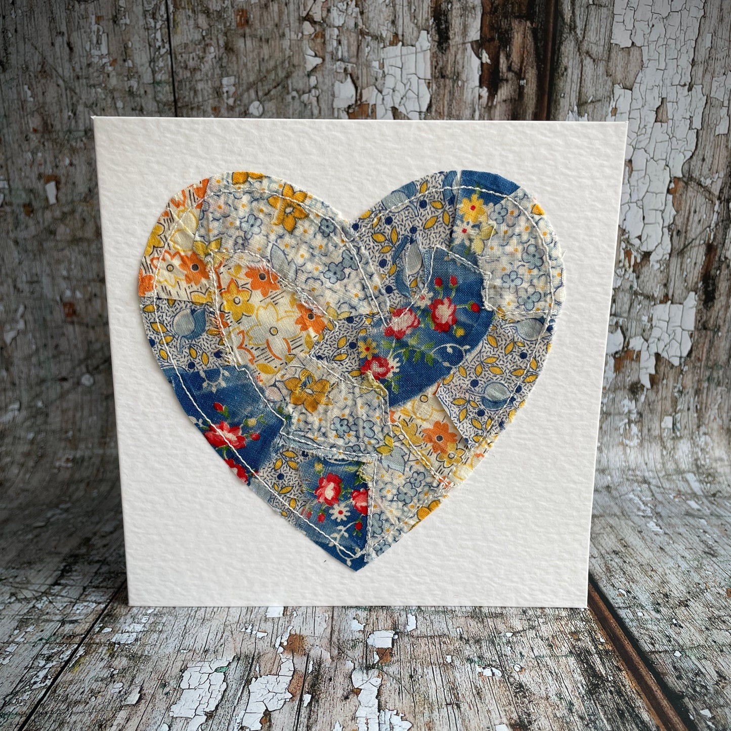 Vintage Feed Sack Card no.19

A beautifully made one of a kind greeting card suitable for any occasion, or just to frame. The heart has been made by carefully patching together sections of genuine vintage feed sack fabrics from the 30's - 50's, on good quality white 225 gsm hammered card, with a simple white envelope in a cello bag. The back of the card is printed with the history of American feed sack fabrics, and the inside left blank for your own special message.

Size: 6" x 6" / 15cm x 15cm