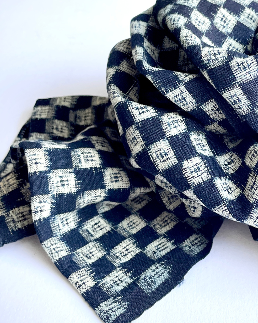 Antique Japanese Kurume Kasuri Fabric Boro Scarf

This beautiful lightweight indigo patterned scarf has been made from antique Japanese woven momen fabric called Kurume kasuri, which was used for making kimonos and yukatas. It has an original fabric boro patch and the ends have been hemmed.
Length approx: 129.5 cm X 34.5 cm / 51" X 13+3/4"
