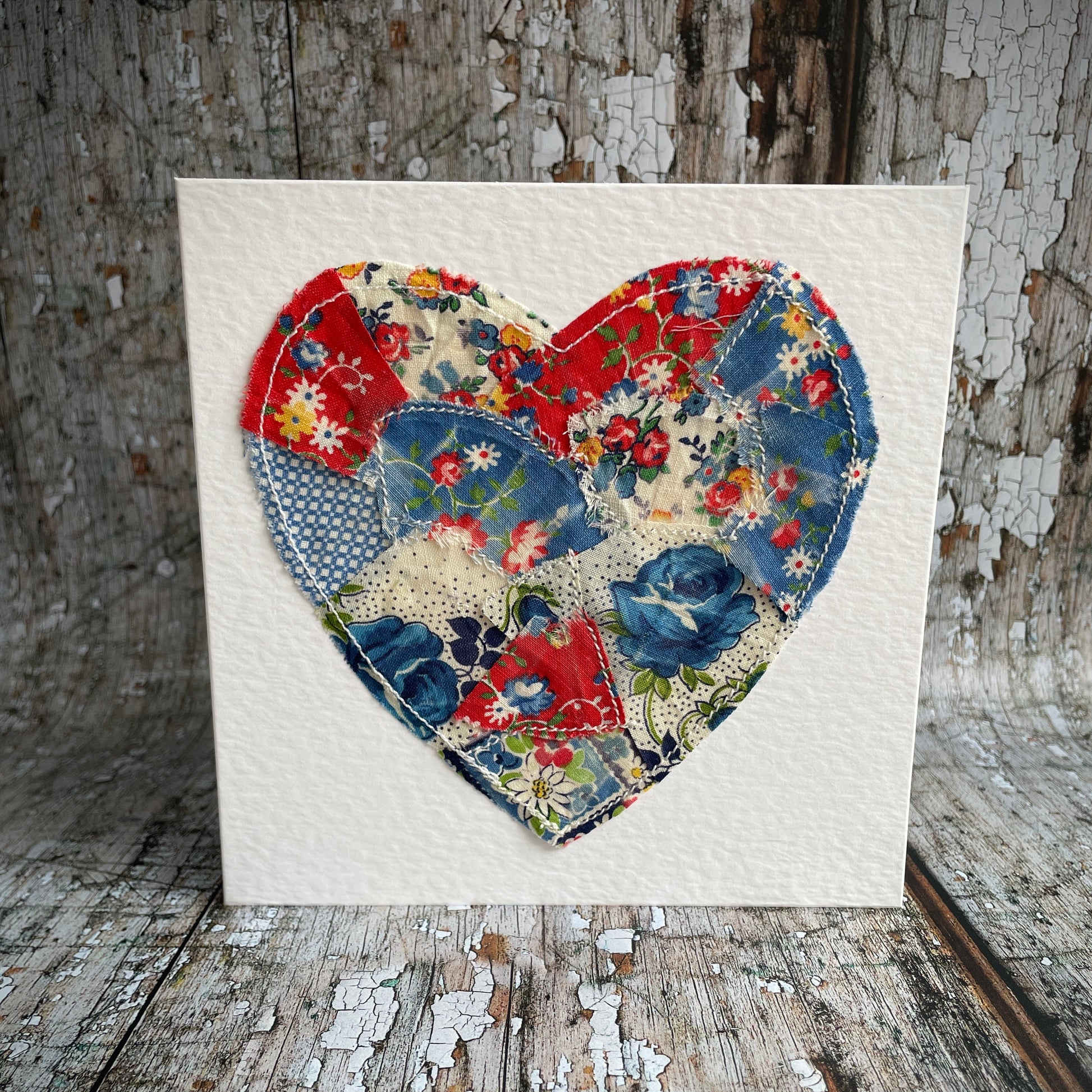Vintage Feed Sack Card no.20

A beautifully made one of a kind greeting card suitable for any occasion, or just to frame. The heart has been made by carefully patching together sections of genuine vintage feed sack fabrics from the 30's - 50's, on good quality white 225 gsm hammered card, with a simple white envelope in a cello bag. The back of the card is printed with the history of American feed sack fabrics, and the inside left blank for your own special message.

Size: 6" x 6" / 15cm x 15cm