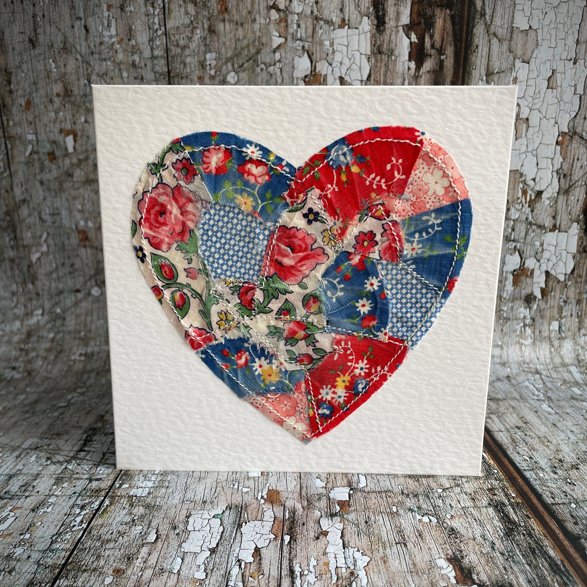 Vintage Feed Sack Card no.21

A beautifully made one of a kind greeting card suitable for any occasion, or just to frame. The heart has been made by carefully patching together sections of genuine vintage feed sack fabrics from the 30's - 50's, on good quality white 225 gsm hammered card, with a simple white envelope in a cello bag. The back of the card is printed with the history of American feed sack fabrics, and the inside left blank for your own special message.

Size: 6" x 6" / 15cm x 15cm