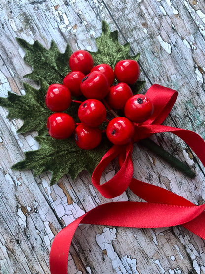 Vintage Holly Berries

This brooch contains unused old stock vintage millinery berries, therefore like all vintage and antique items they may show slight signs of age.

Perfect as a gift for a vintage fan, dressing up, costumes, display and photo props.

Measurements Approximately:
Width: 10.5 cm / 4"
Length: 14 cm / 5+3/4"
