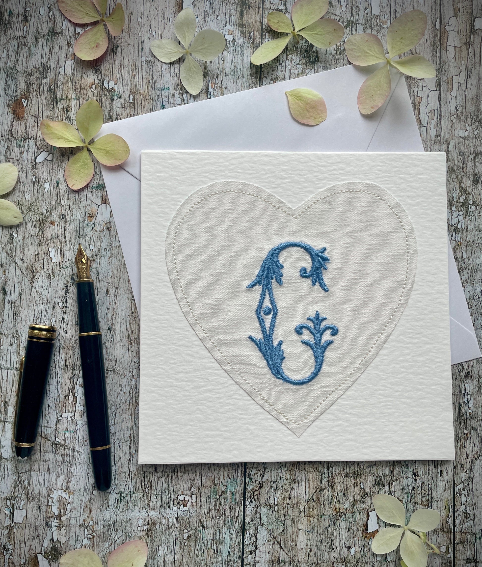 Embroidered Initial Card Blue C or G

Beautifully made one of a kind romantic card suitable for any occasion, or just to frame. The initial C or G has been embroidered with blue colour thread onto a piece of heart shaped vintage linen, then sewn onto a good quality acid free white 225 gsm hammered card, the inside left blank for your own special message. It comes with a simple white envelope in a cello bag.

Size: 6" x 6" / 15cm x 15cm
