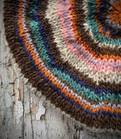 Classic 40's Style Beret no.28

Beautifully hand knitted beret in Icelandic Lettlopi wool, perfect for keeping your head warm on cold days and adding a touch of 40's style to any outfit. Knitted in oat, viridian, dark chocolate brown, pink, lavender, purple and orange stripes, with an oat ribbed band that gives the hat a snug fit.

SIZE: adult.

CARE: hand wash or machine wash on wool cycle at 30 degrees, dry flat, do not tumble dry.