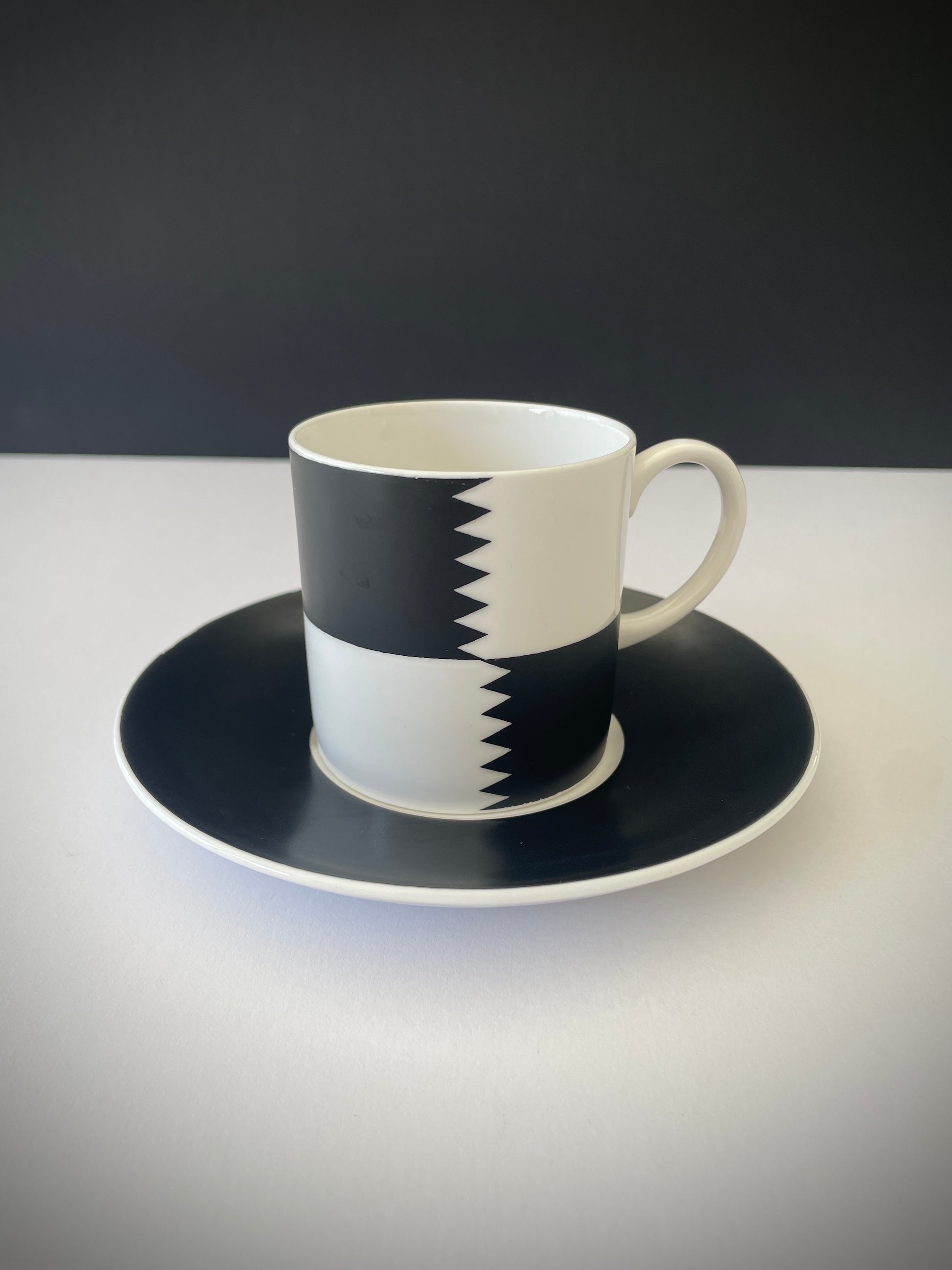 VINTAGE SUSIE COOPER HERALDRY CUP AND SAUCER
Vintage Susie Cooper coffee cup and saucer in the black and white 'Heraldry' pattern, her design for Wedgwood between 1960 - 1969. Made in Bone China, a porcelain that's lighter, more delicate and translucent compared to standard porcelain.
In beautiful condition with no cracks or chips.
Perfect to display or use as a photo prop.
Width of saucer: 14 cm / 5+1/2"
Height of cup: 6.5 cm / 2+1/2"
Width of cup: 6.5 cm / 2+1/2"