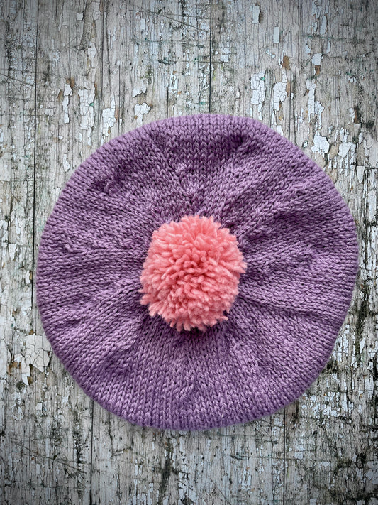 Children's Beret 6 - 24 mths

Beautifully hand knitted beret in Rowan pure wool, perfect for keeping little heads warm on cold days. Knitted in mauve, with a big sugar pink pom and a ribbed band that gives the hat a snug fit. It would look stunning on boys or girls.

SIZE: child 6-24 months.
Diameter 27cm / 10+1/2".
CARE: hand wash or machine wash on wool cycle at 30 degrees, dry flat, do not tumble dry.