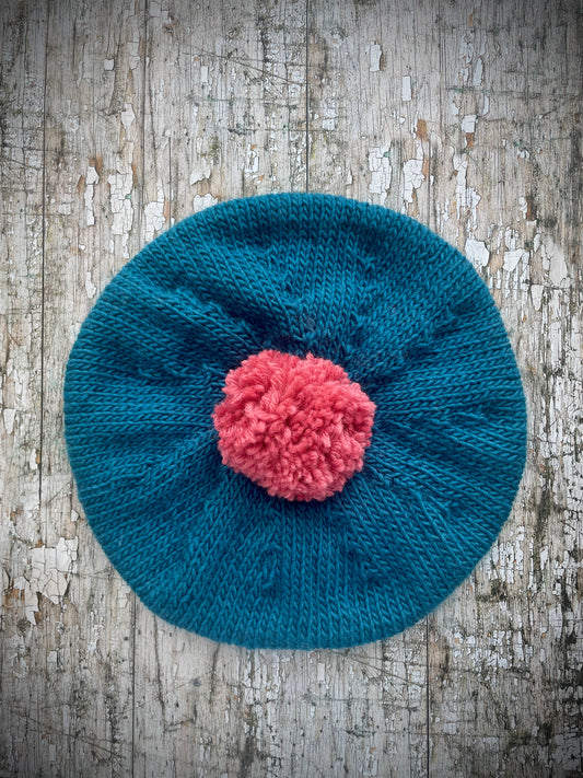 Children's Beret 6 - 24 months

Beautifully hand knitted beret in a soft Debbbie Bliss and Rowan pure wool, perfect for keeping little heads warm on cold days. Knitted in dark turquoise, with a big pink pom and a ribbed band that gives the hat a snug fit. It would look stunning on boys or girls.

SIZE: child 6 - 24 months.