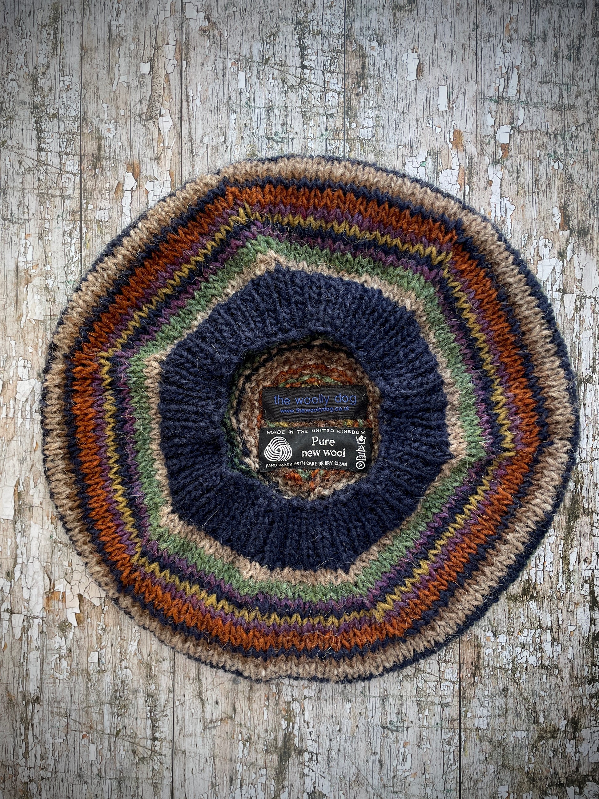 Classic 40's Style Beret no.7

Beautifully hand knitted beret in Icelandic wool, perfect for keeping your head warm on cold days and adding a touch of 40's style to any outfit. Knitted in navy, dark oat, lyme green, violet heather, kelp, burnt orange and milk chocolate stripes, with a navy ribbed band that gives the hat a snug fit.

SIZE: adult.&nbsp;

CARE: hand wash or machine wash on wool cycle at 30 degrees, dry flat, do not tumble dry.