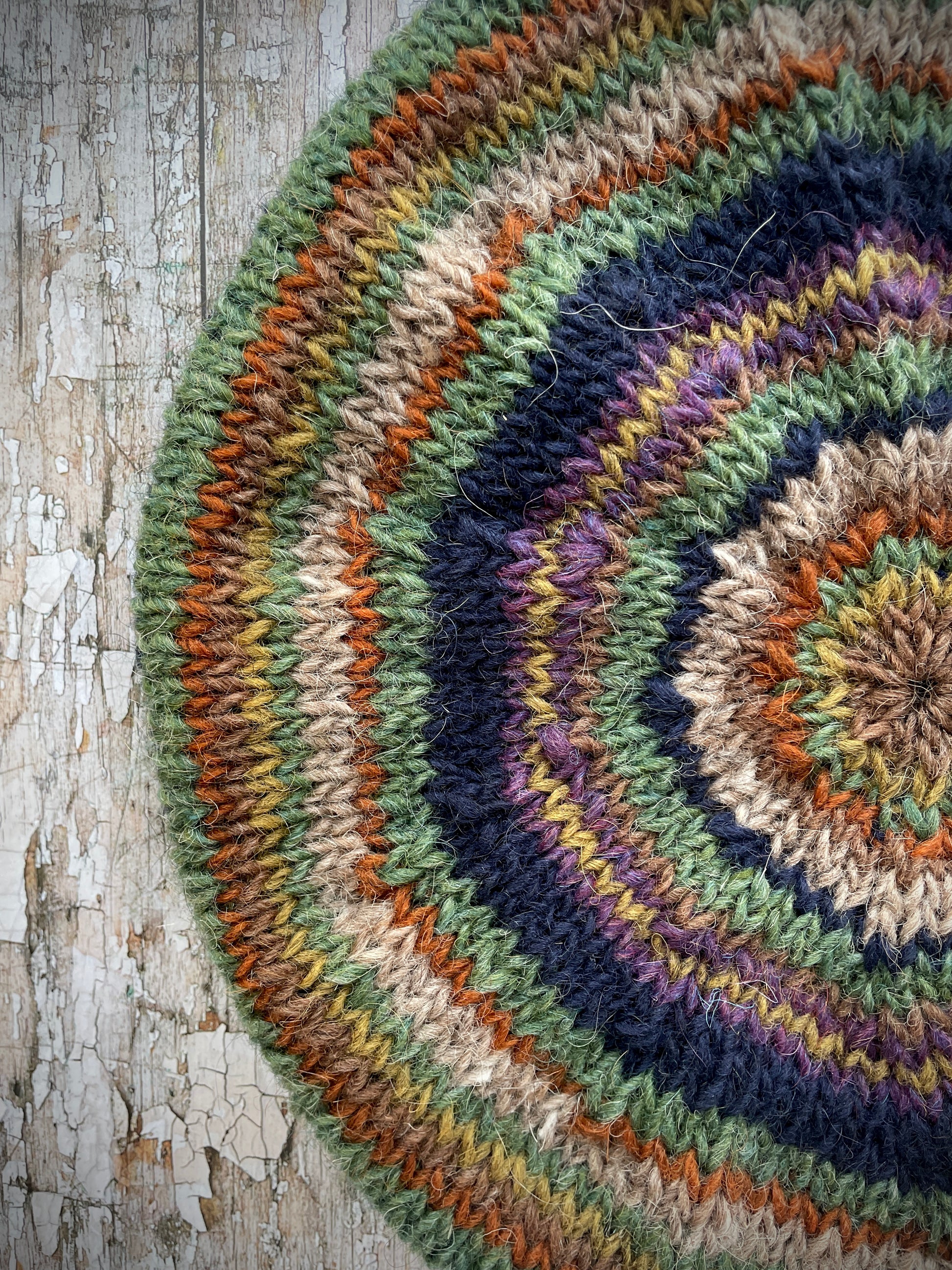Classic 40's Style Beret no.7

Beautifully hand knitted beret in Icelandic wool, perfect for keeping your head warm on cold days and adding a touch of 40's style to any outfit. Knitted in navy, dark oat, lyme green, violet heather, kelp, burnt orange and milk chocolate stripes, with a navy ribbed band that gives the hat a snug fit.

SIZE: adult.&nbsp;

CARE: hand wash or machine wash on wool cycle at 30 degrees, dry flat, do not tumble dry.