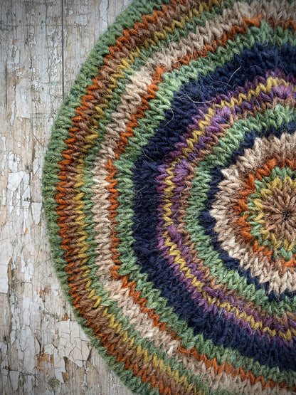 Classic 40's Style Beret no.7

Beautifully hand knitted beret in Icelandic wool, perfect for keeping your head warm on cold days and adding a touch of 40's style to any outfit. Knitted in navy, dark oat, lyme green, violet heather, kelp, burnt orange and milk chocolate stripes, with a navy ribbed band that gives the hat a snug fit.

SIZE: adult.&nbsp;

CARE: hand wash or machine wash on wool cycle at 30 degrees, dry flat, do not tumble dry.