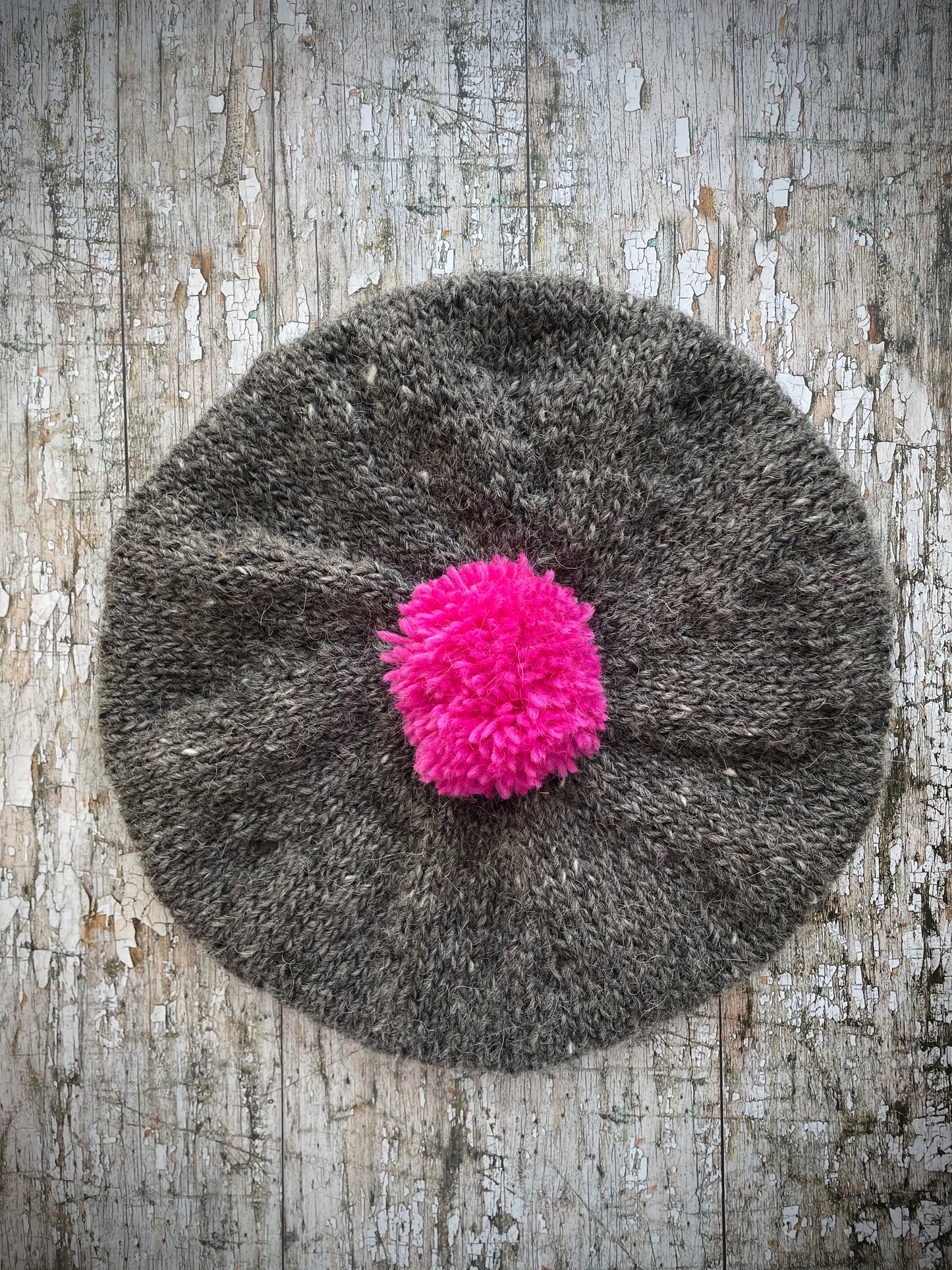 Hand Knitted Wool Beret Grey Tweed + Bright Pink

Beautifully hand knitted beret in Icelandic pure wool, perfect for keeping your head warm on cold days. Knitted in grey tweed with a bright pink pom and pink ribbed band that gives the hat a snug fit.

SIZE: adult.

CARE: hand wash or machine wash on wool cycle at 30 degrees, dry flat, do not tumble dry.