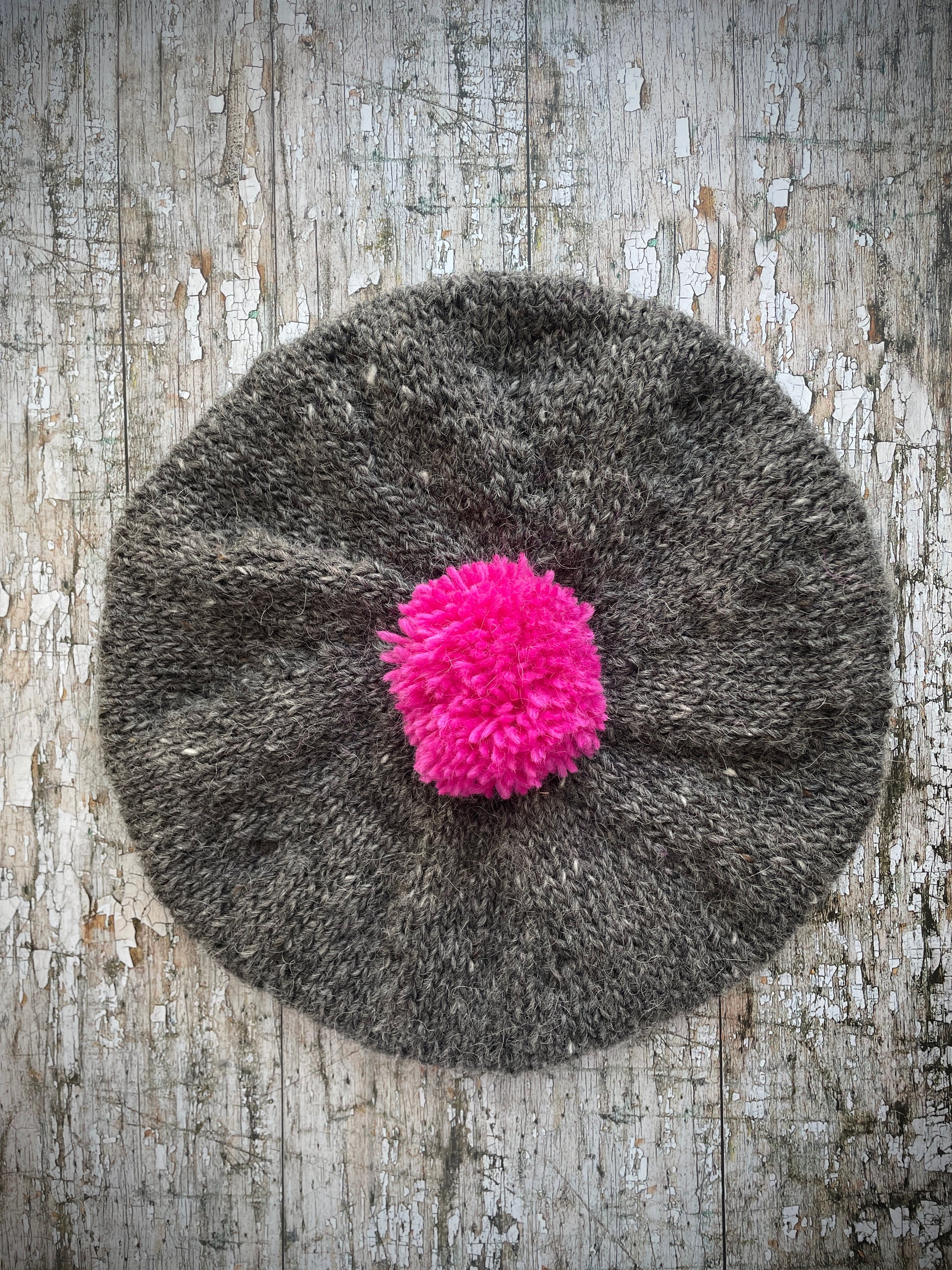 Hand Knitted Wool Beret Grey Tweed + Bright Pink

Beautifully hand knitted beret in Icelandic pure wool, perfect for keeping your head warm on cold days. Knitted in grey tweed with a bright pink pom and pink ribbed band that gives the hat a snug fit.

SIZE: adult.

CARE: hand wash or machine wash on wool cycle at 30 degrees, dry flat, do not tumble dry.