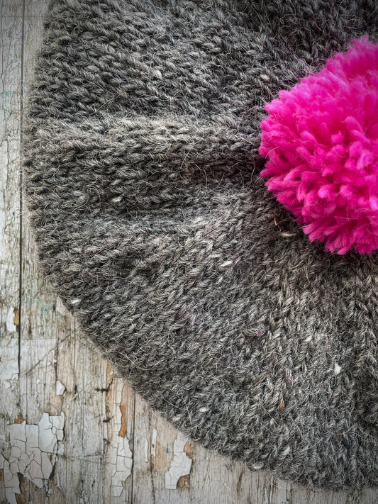 Hand Knitted Wool Beret Grey Tweed + Bright Pink

Beautifully hand knitted beret in Icelandic pure wool, perfect for keeping your head warm on cold days. Knitted in grey tweed with a bright pink pom and pink ribbed band that gives the hat a snug fit.

SIZE: adult.

CARE: hand wash or machine wash on wool cycle at 30 degrees, dry flat, do not tumble dry.