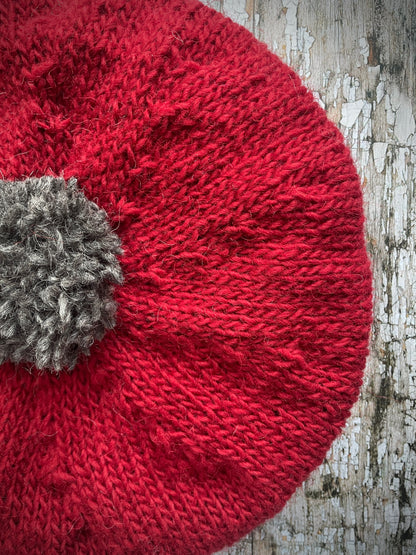 Hand Knitted Wool Beret Red + Grey Tweed

Beautifully hand knitted beret in Icelandic pure wool, perfect for keeping your head warm on cold days. Knitted in red with a grey pom and grey ribbed band that gives the hat a snug fit.

SIZE: adult.

CARE: hand wash or machine wash on wool cycle at 30 degrees, dry flat, do not tumble dry.