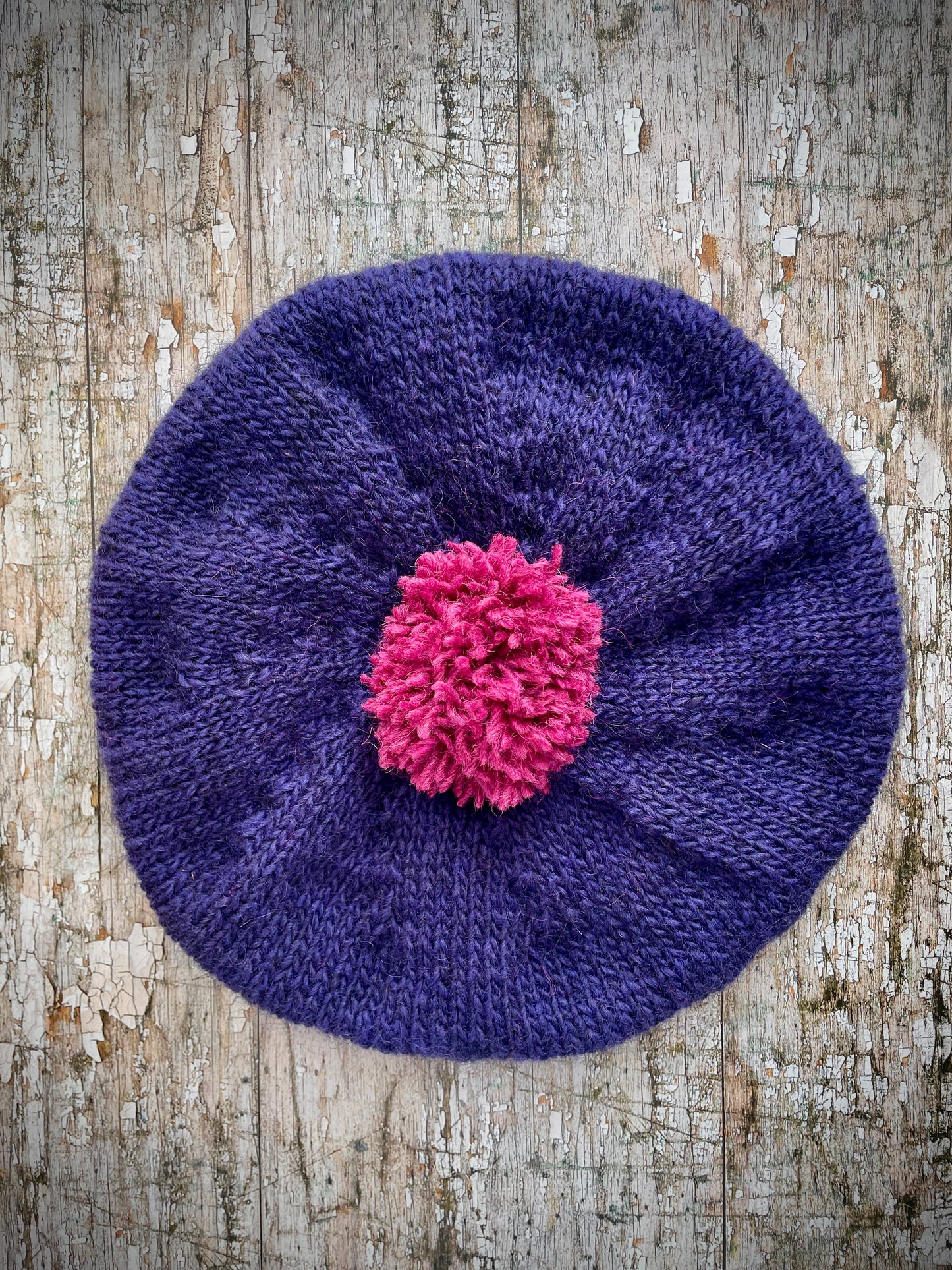 Hand Knitted Wool Dark Royal Blue + Fuchsia Beret

Beautifully hand knitted beret in Icelandic pure wool, perfect for keeping your head warm on cold days. Knitted in a beautiful dark royal blue, a deep, vibrant and rich shade of blue, lighter than navy blue with subtle purple undertones and fuchsia, with a big fuchsia pom and fuchsia ribbed band that gives the hat a snug fit.

SIZE: adult.

CARE: hand wash or machine wash on wool cycle at 30 degrees, dry flat, do not tumble dry.