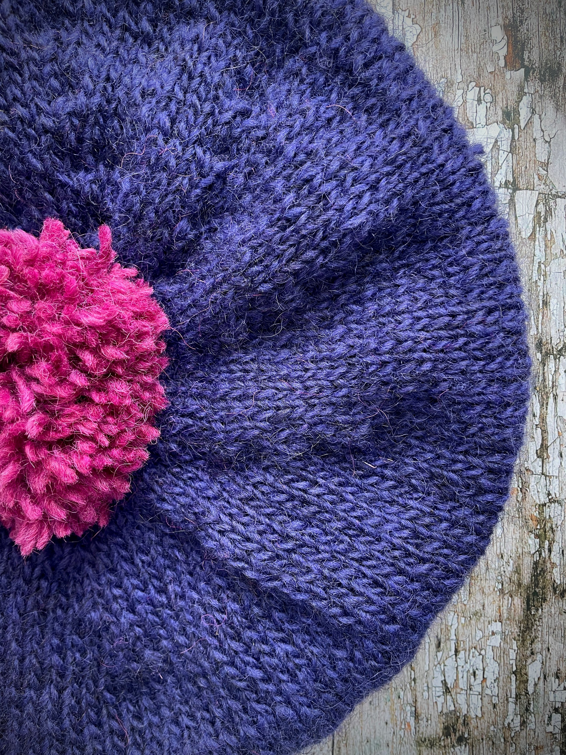 Hand Knitted Wool Dark Royal Blue + Fuchsia Beret

Beautifully hand knitted beret in Icelandic pure wool, perfect for keeping your head warm on cold days. Knitted in a beautiful dark royal blue, a deep, vibrant and rich shade of blue, lighter than navy blue with subtle purple undertones and fuchsia, with a big fuchsia pom and fuchsia ribbed band that gives the hat a snug fit.

SIZE: adult.

CARE: hand wash or machine wash on wool cycle at 30 degrees, dry flat, do not tumble dry.