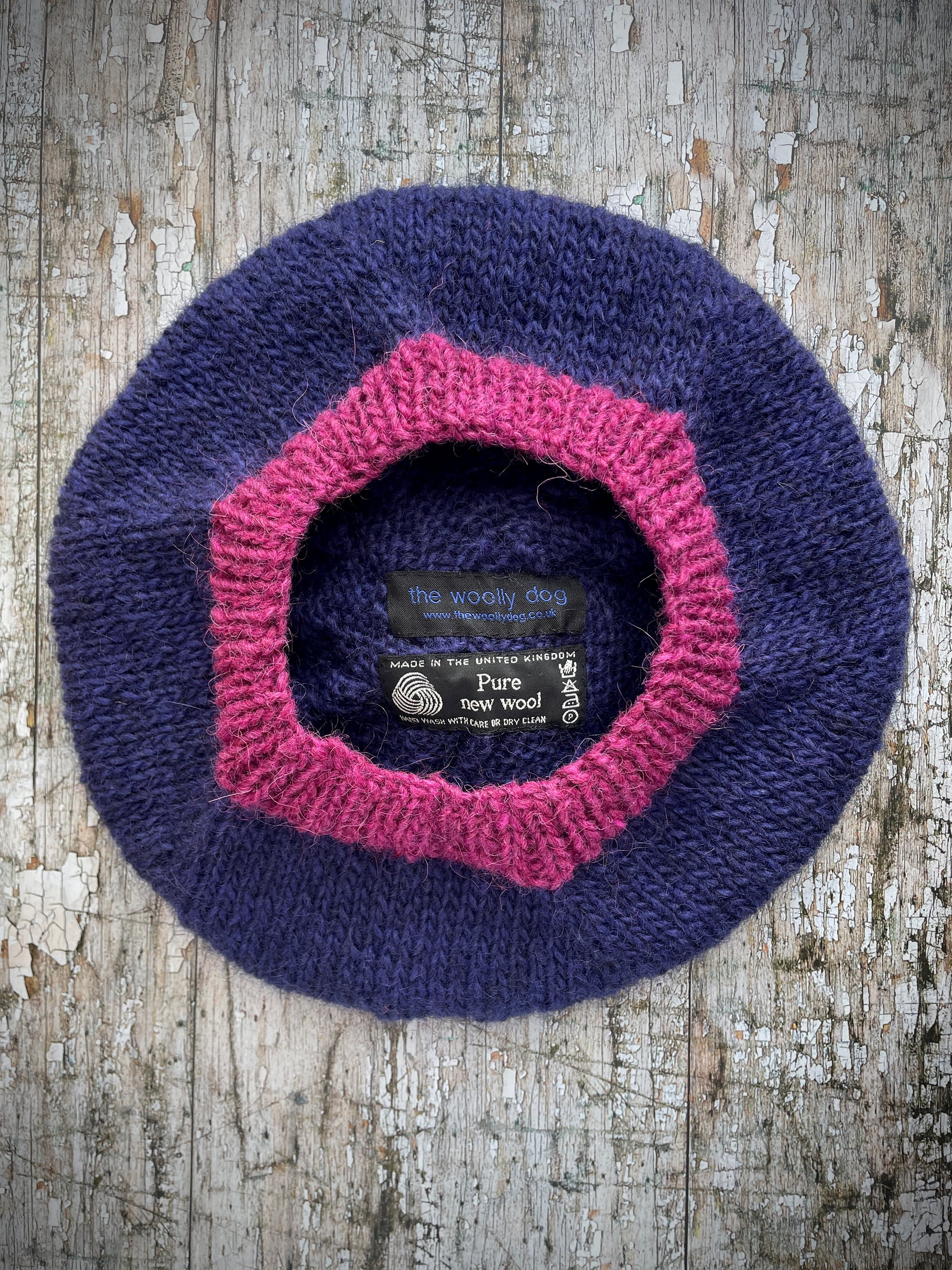 Hand Knitted Wool Dark Royal Blue + Fuchsia Beret

Beautifully hand knitted beret in Icelandic pure wool, perfect for keeping your head warm on cold days. Knitted in a beautiful dark royal blue, a deep, vibrant and rich shade of blue, lighter than navy blue with subtle purple undertones and fuchsia, with a big fuchsia pom and fuchsia ribbed band that gives the hat a snug fit.

SIZE: adult.

CARE: hand wash or machine wash on wool cycle at 30 degrees, dry flat, do not tumble dry.
