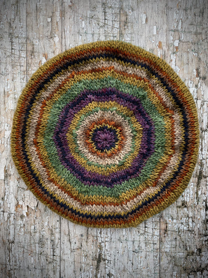 Classic 40's Style Beret no.18

Beautifully hand knitted beret in Icelandic wool, perfect for keeping your head warm on cold days and adding a touch of 40's style to any outfit. Knitted green heather, dark oat, kelp, violet heather, navy, burnt orange and milk chocolate stripes, with a green heather ribbed band that gives the hat a snug fit.

SIZE: adult.

CARE: hand wash or machine wash on wool cycle at 30 degrees, dry flat, do not tumble dry.