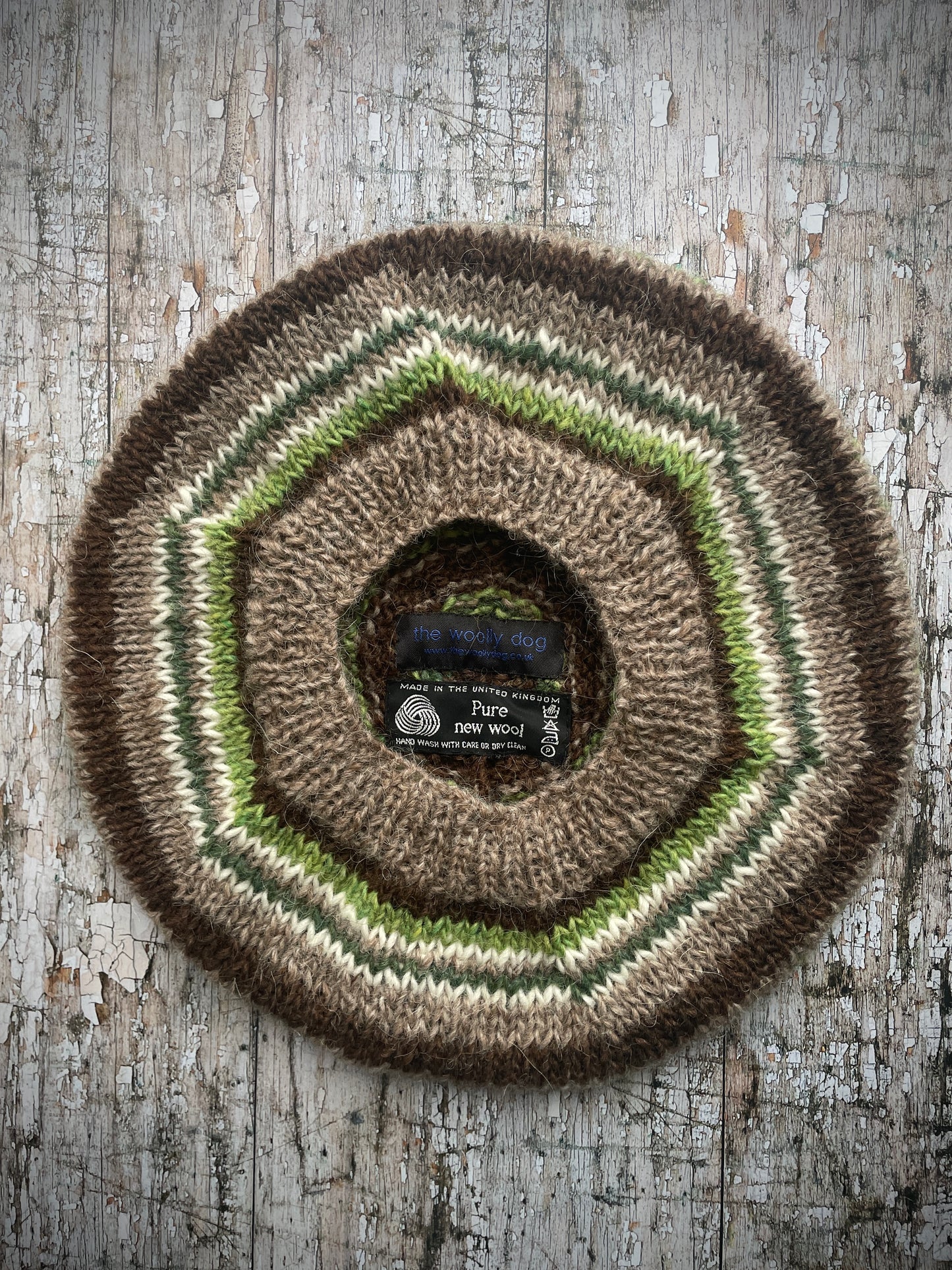Classic 40's Style Beret no.42

Beautifully hand knitted beret in Icelandic Lettlopi wool, perfect for keeping your head warm on cold days and adding a touch of 40's style to any outfit. Knitted in oat heather, dark chocolate brown, bright green, white and pine stripes, with an oat heather ribbed band that gives the hat a snug fit.

SIZE: adult.

CARE: hand wash or machine wash on wool cycle at 30 degrees, dry flat, do not tumble dry.