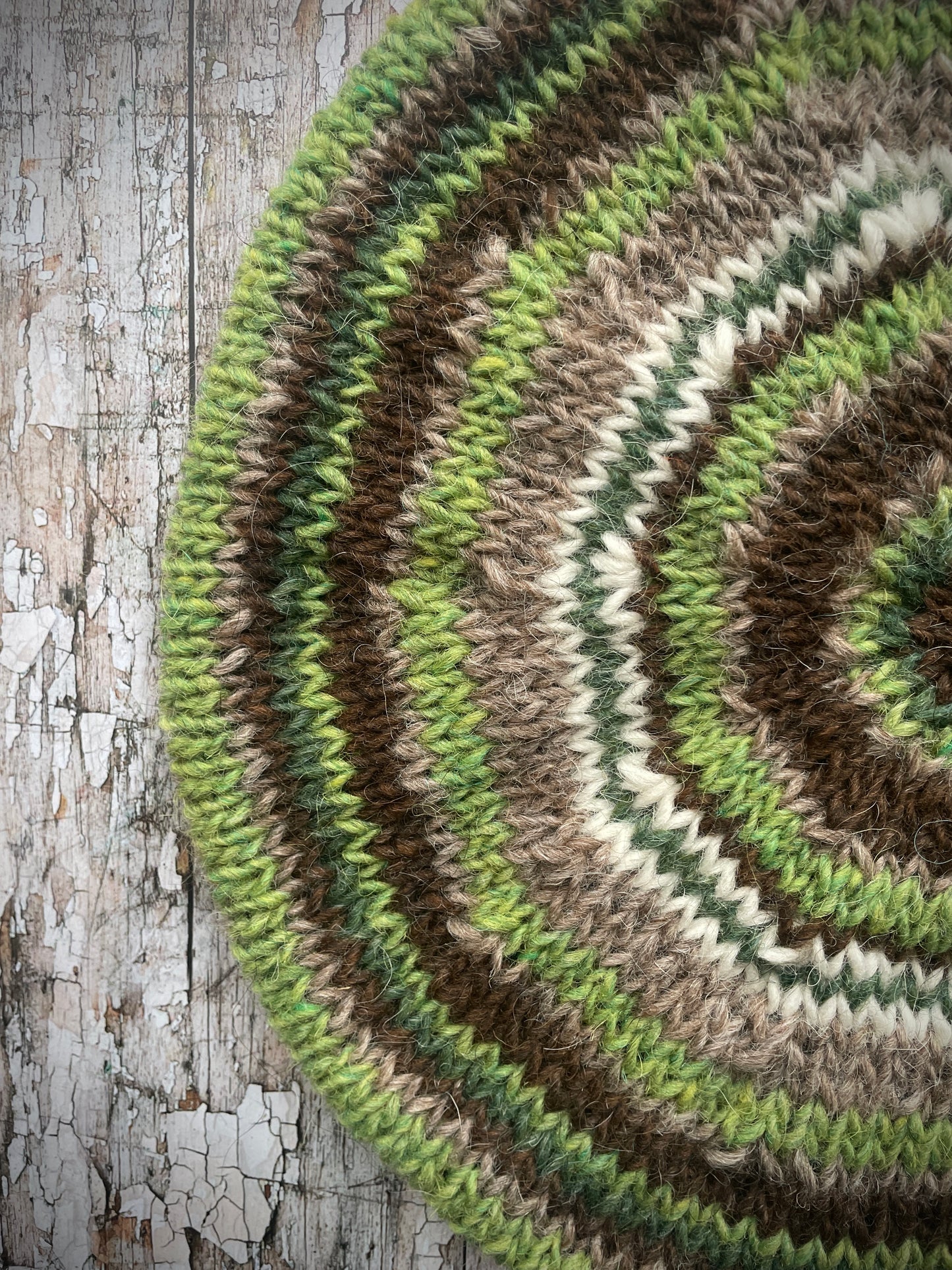 Classic 40's Style Beret no.42

Beautifully hand knitted beret in Icelandic Lettlopi wool, perfect for keeping your head warm on cold days and adding a touch of 40's style to any outfit. Knitted in oat heather, dark chocolate brown, bright green, white and pine stripes, with an oat heather ribbed band that gives the hat a snug fit.

SIZE: adult.

CARE: hand wash or machine wash on wool cycle at 30 degrees, dry flat, do not tumble dry.