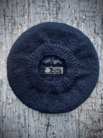 Large Hand Knitted Wool Beret Dark Navy Blue

Beautifully hand knitted slouchy beret in Icelandic pure wool, perfect for keeping your head warm on cold days, knitted in a dark navy blue colour, with a ribbed band that gives the hat a snug fit.

SIZE: LARGE.

CARE: hand wash or machine wash on wool cycle at 30 degrees, dry flat, do not tumble dry.